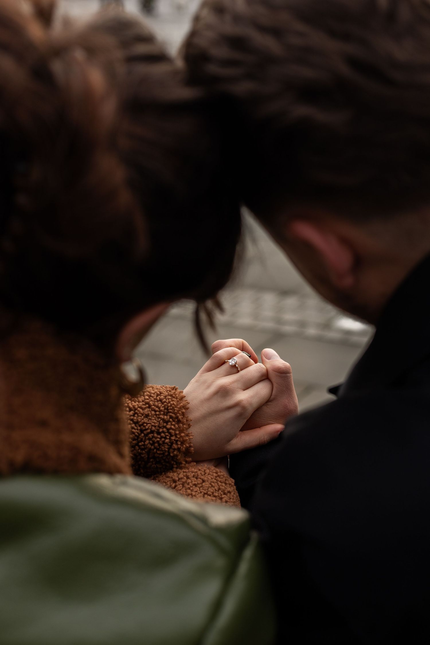 Couple embracing during intimate engagement photoshoot in Huddersfield park