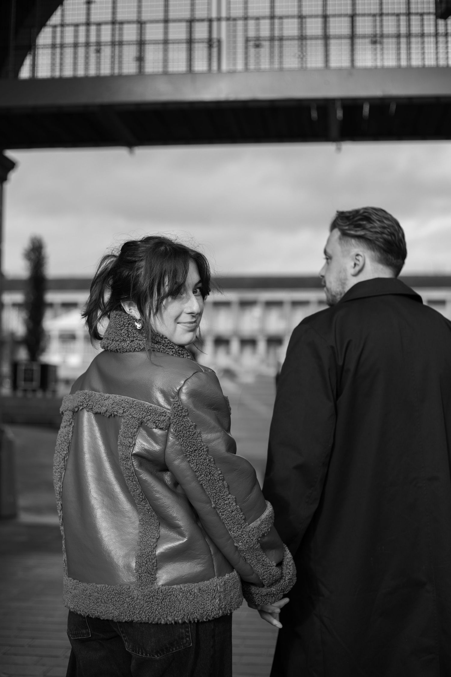 Engaged couple laughing together during natural outdoor engagement photography West Yorkshire