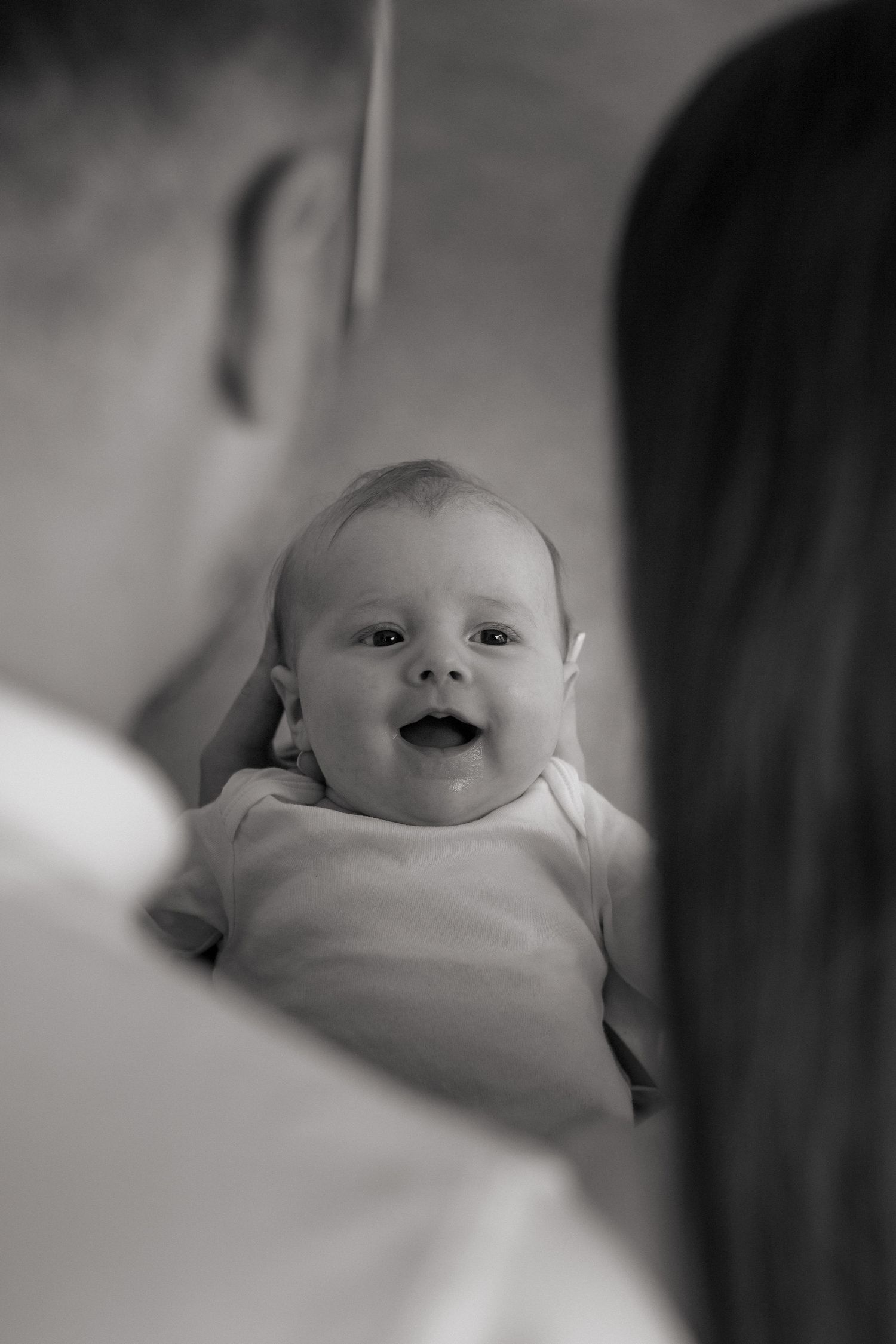Parents and newborn together in nursery room during storytelling photography Huddersfield