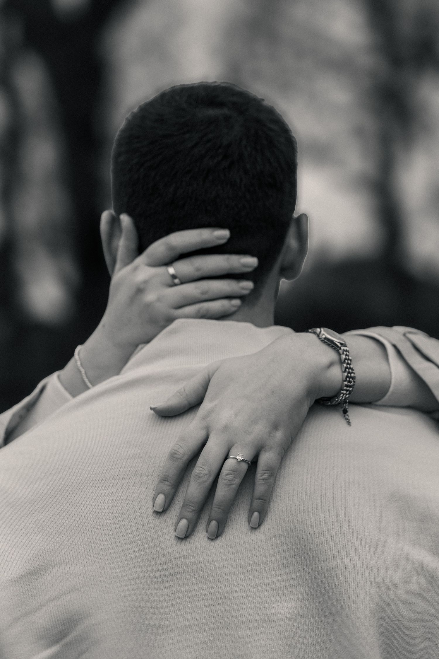 Engagement couple sitting together on woodland path during photoshoot Huddersfield