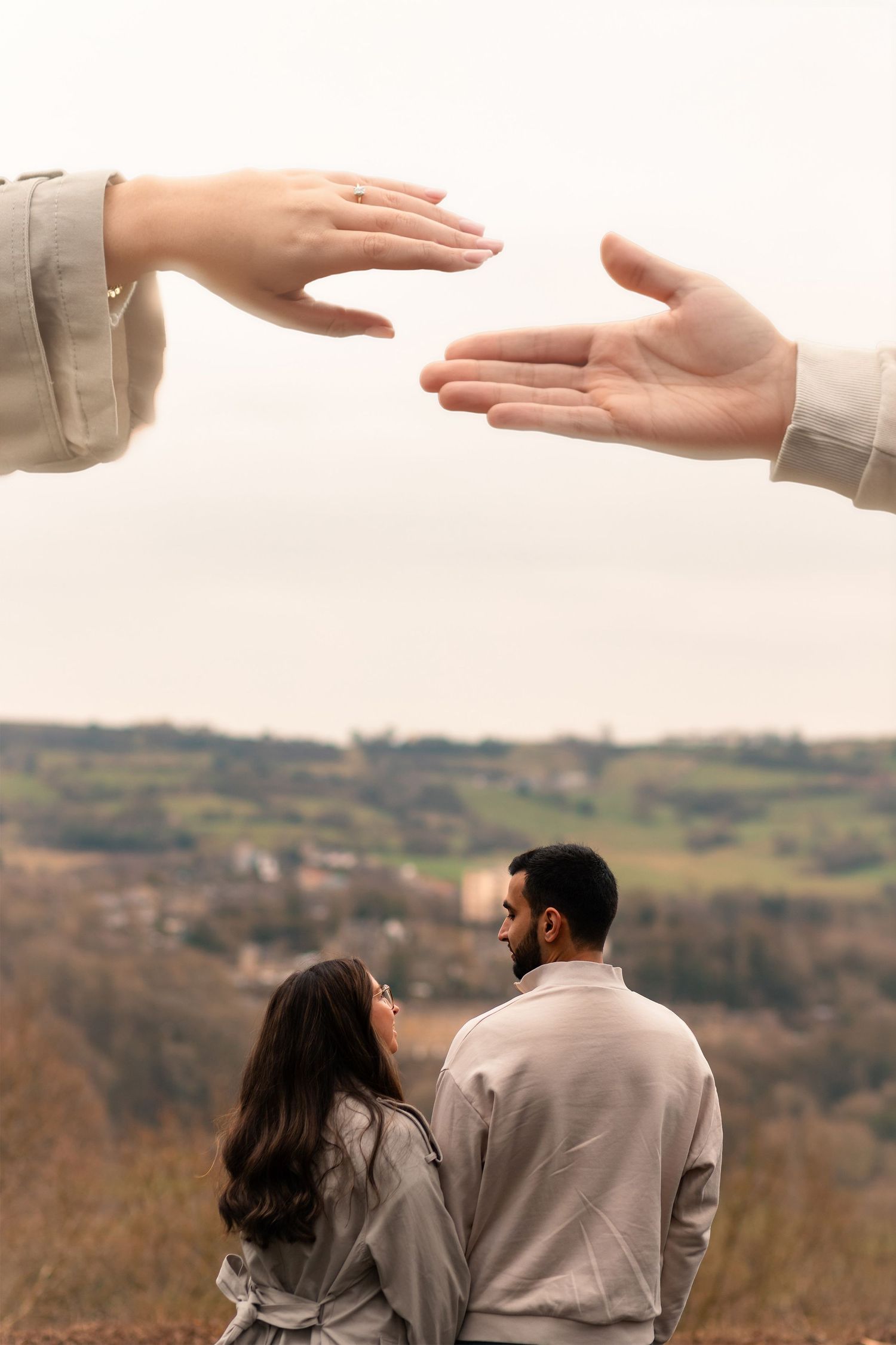 Couple walking hand in hand during engagement photoshoot in Huddersfield countryside