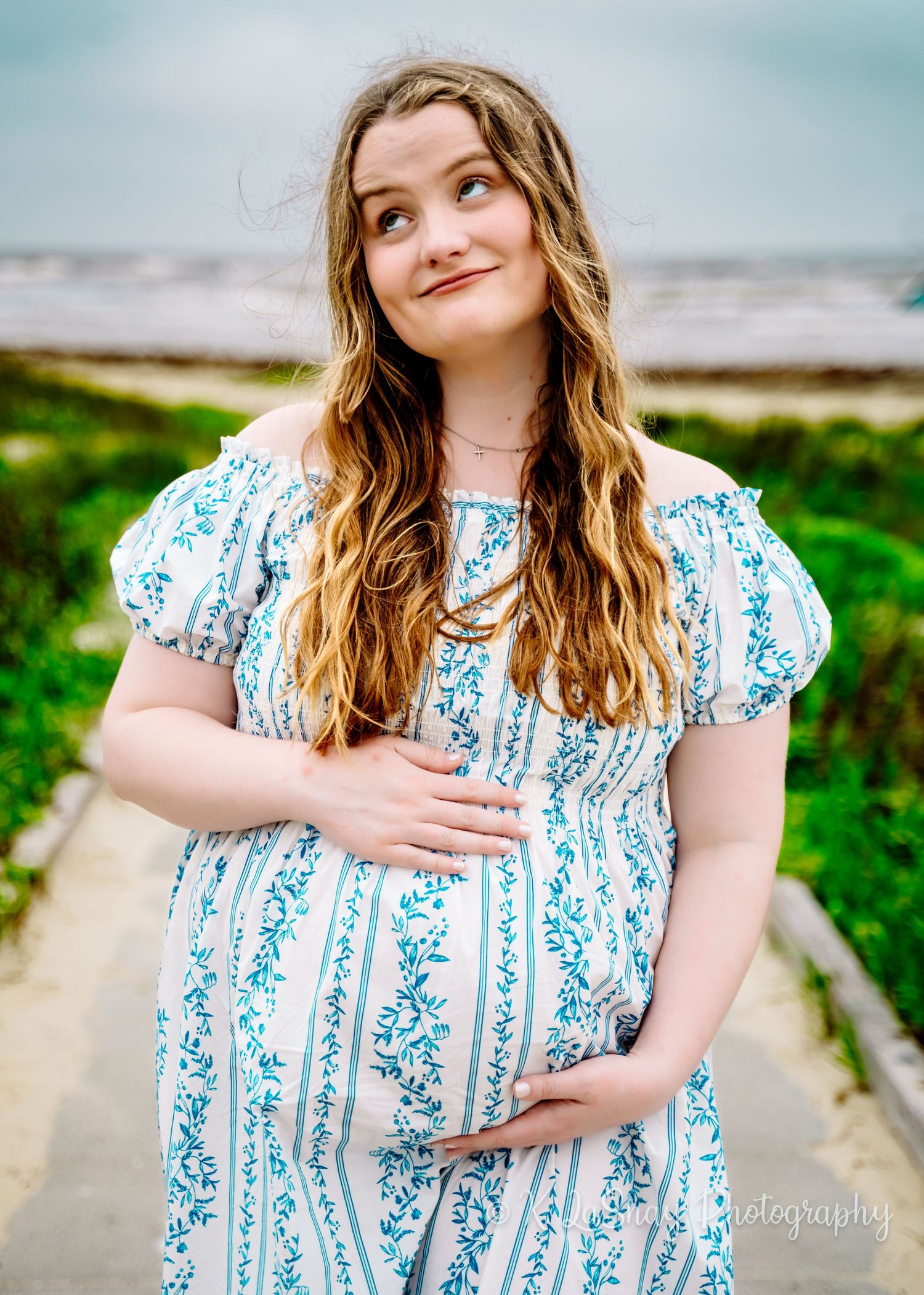 Woman in blue and white floral dress poses outdoors in a series of casual portrait shots.