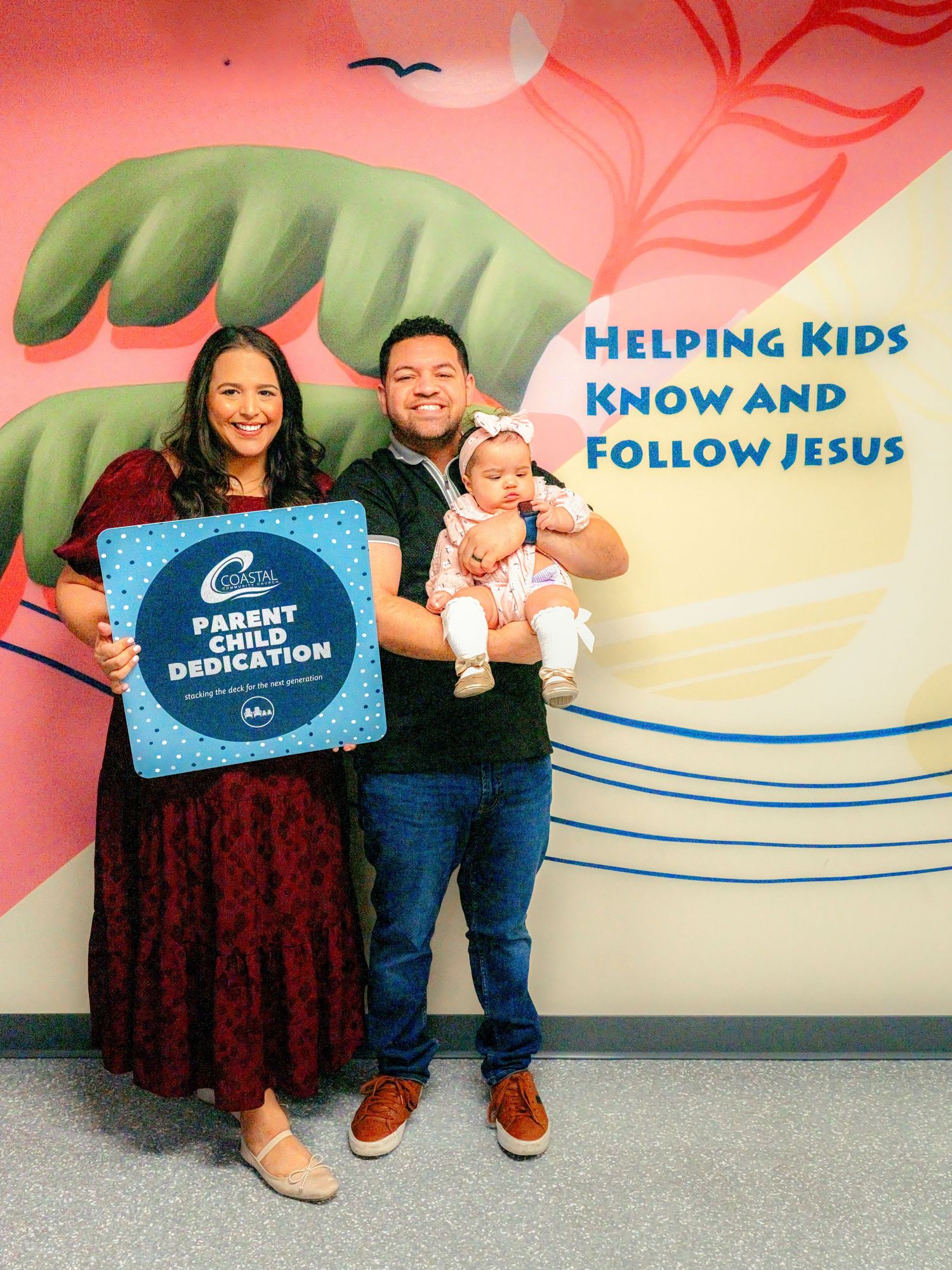 Church children's ministry area with colorful wall decorations and signs.
