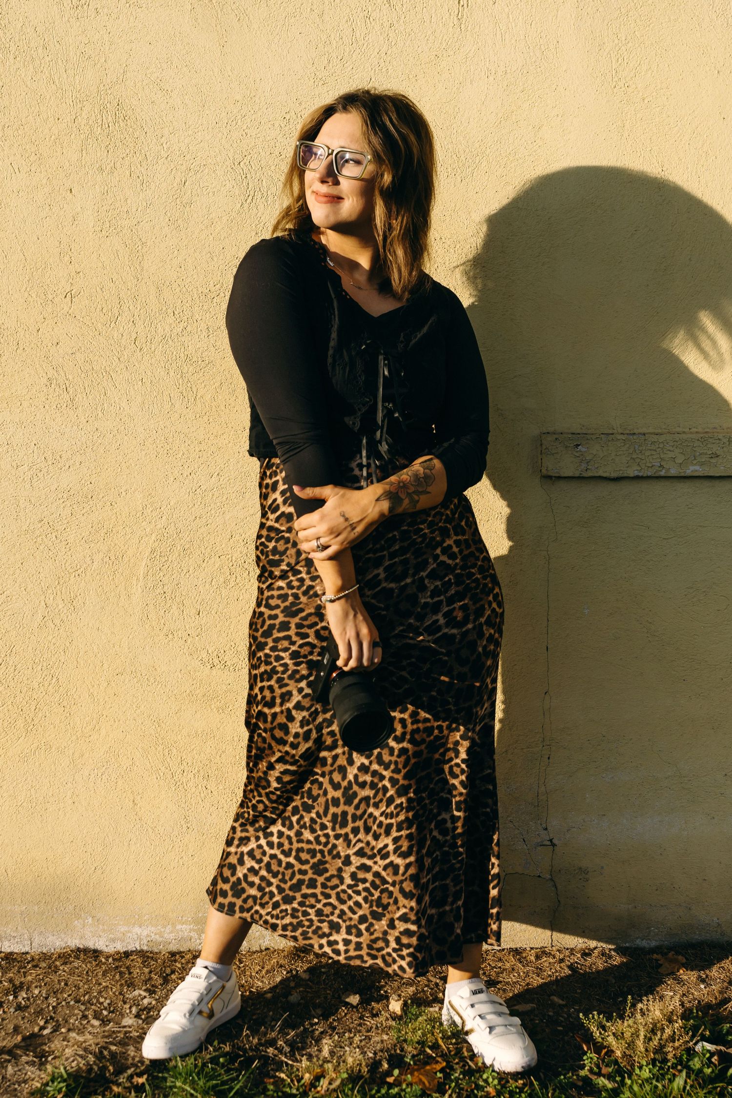 Photographer Dani Ledbetter holding a film camera in Missouri