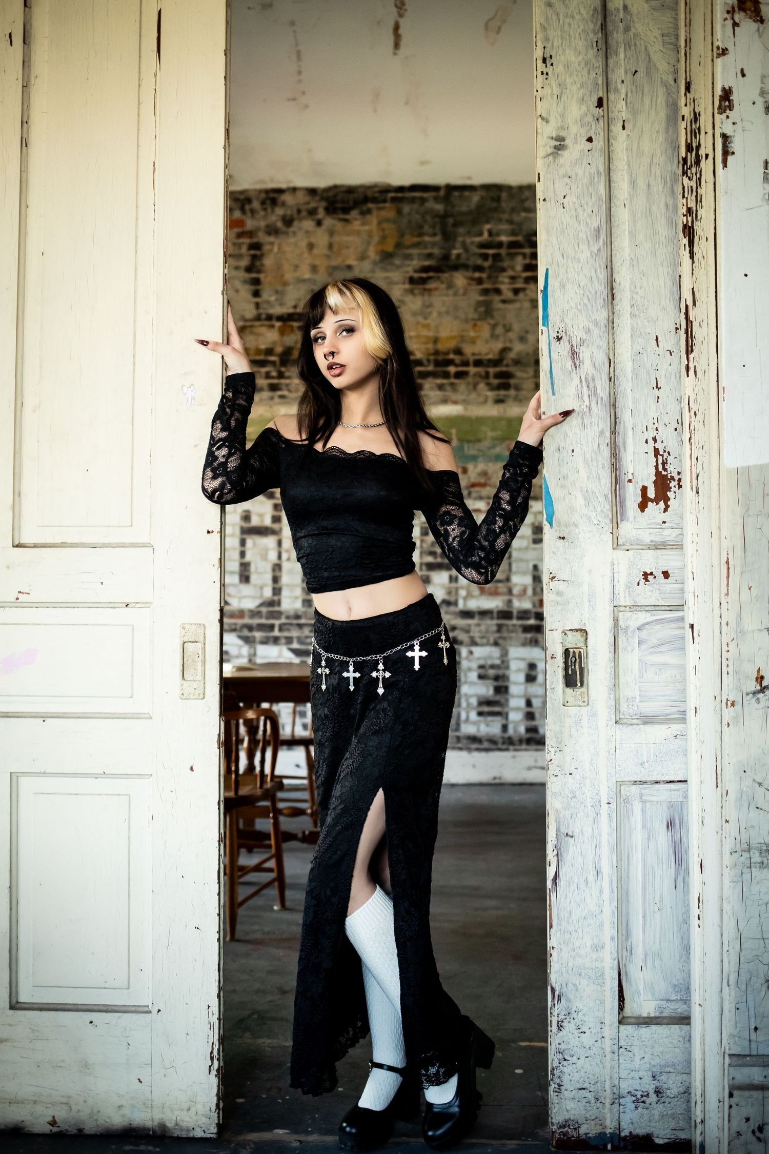 A series of artistic photos in an abandoned building with white doors and exposed brick walls.