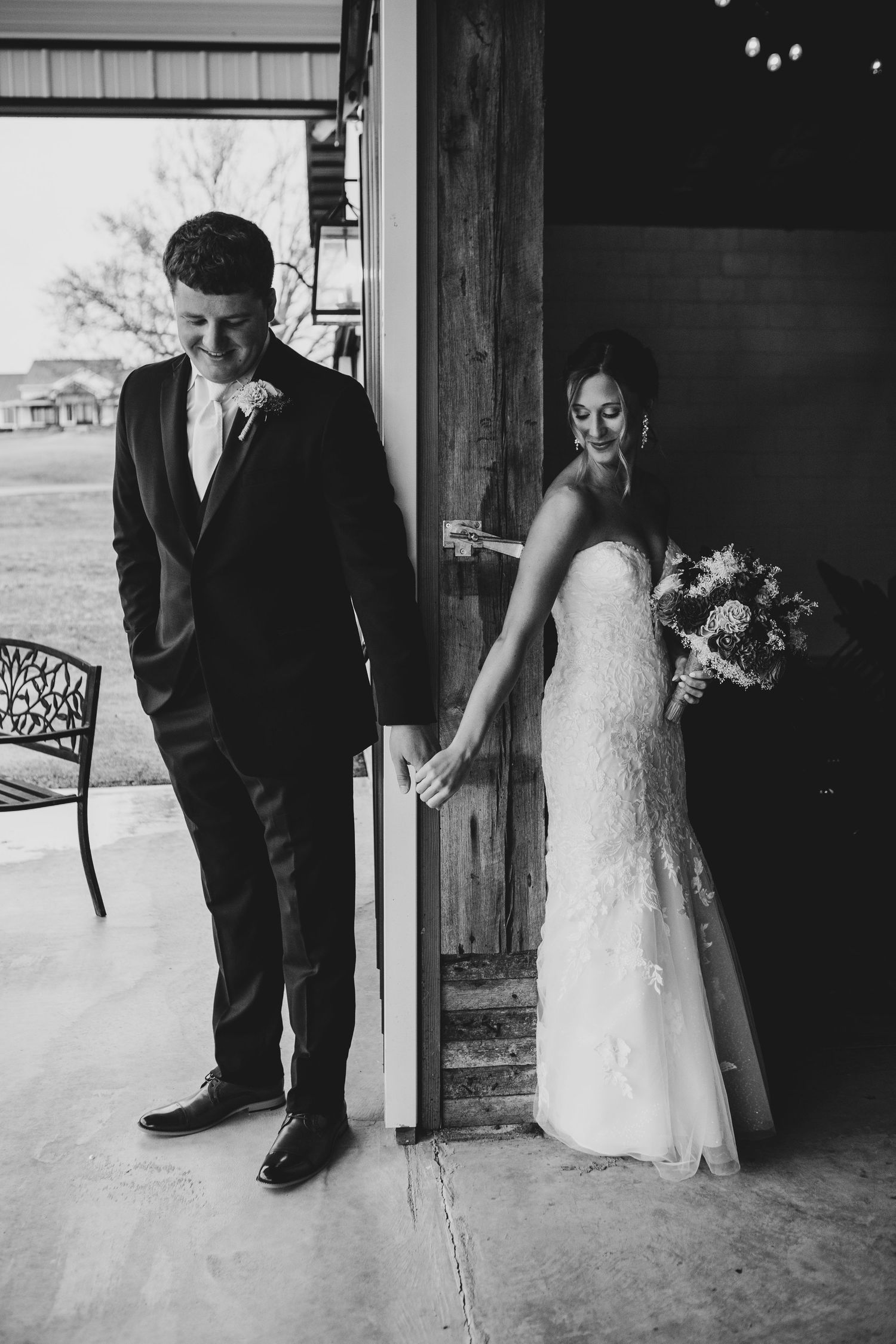 A series of black and white wedding photos showing intimate moments between a bride and groom at a rustic venue doorway.