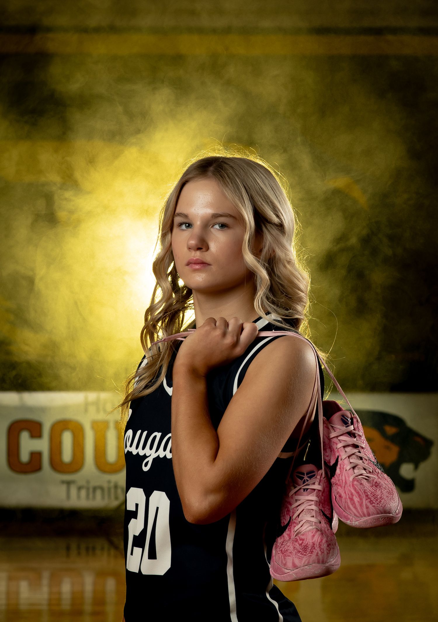 A series of moody sports portraits with dramatic lighting against a textured gold and brown backdrop.