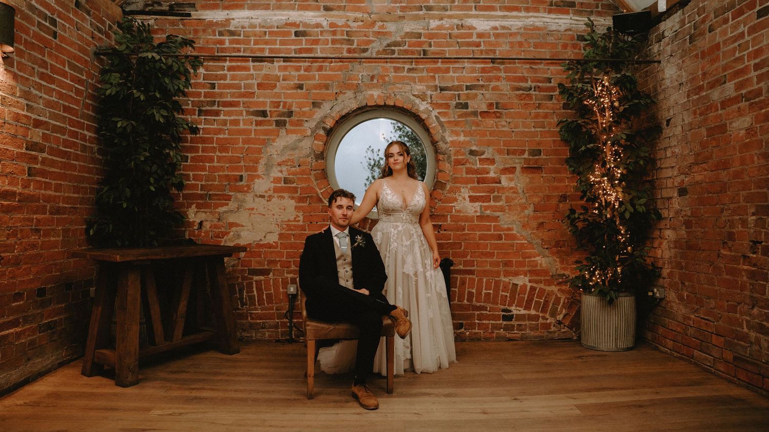Rustic brick wall venue decorated for an elegant wedding ceremony.