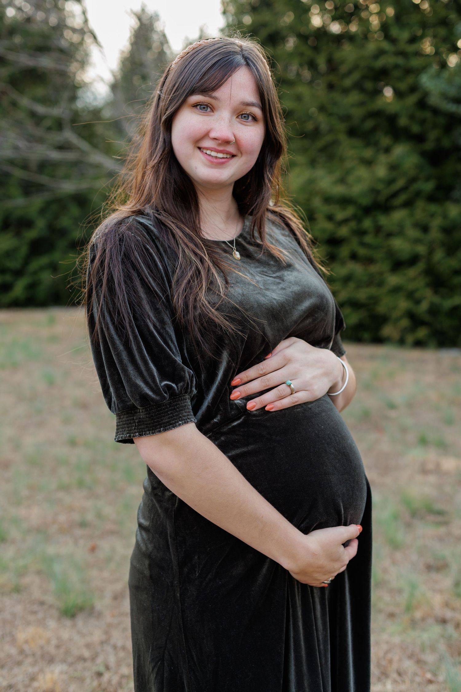 Young Mom holding her pregnant belly in Williamsport Pennsylvania