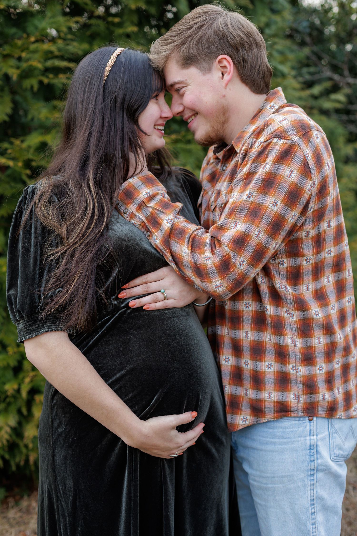 Outdoor maternity session in Williamsport Pennsylvania mom and dad nose to nose