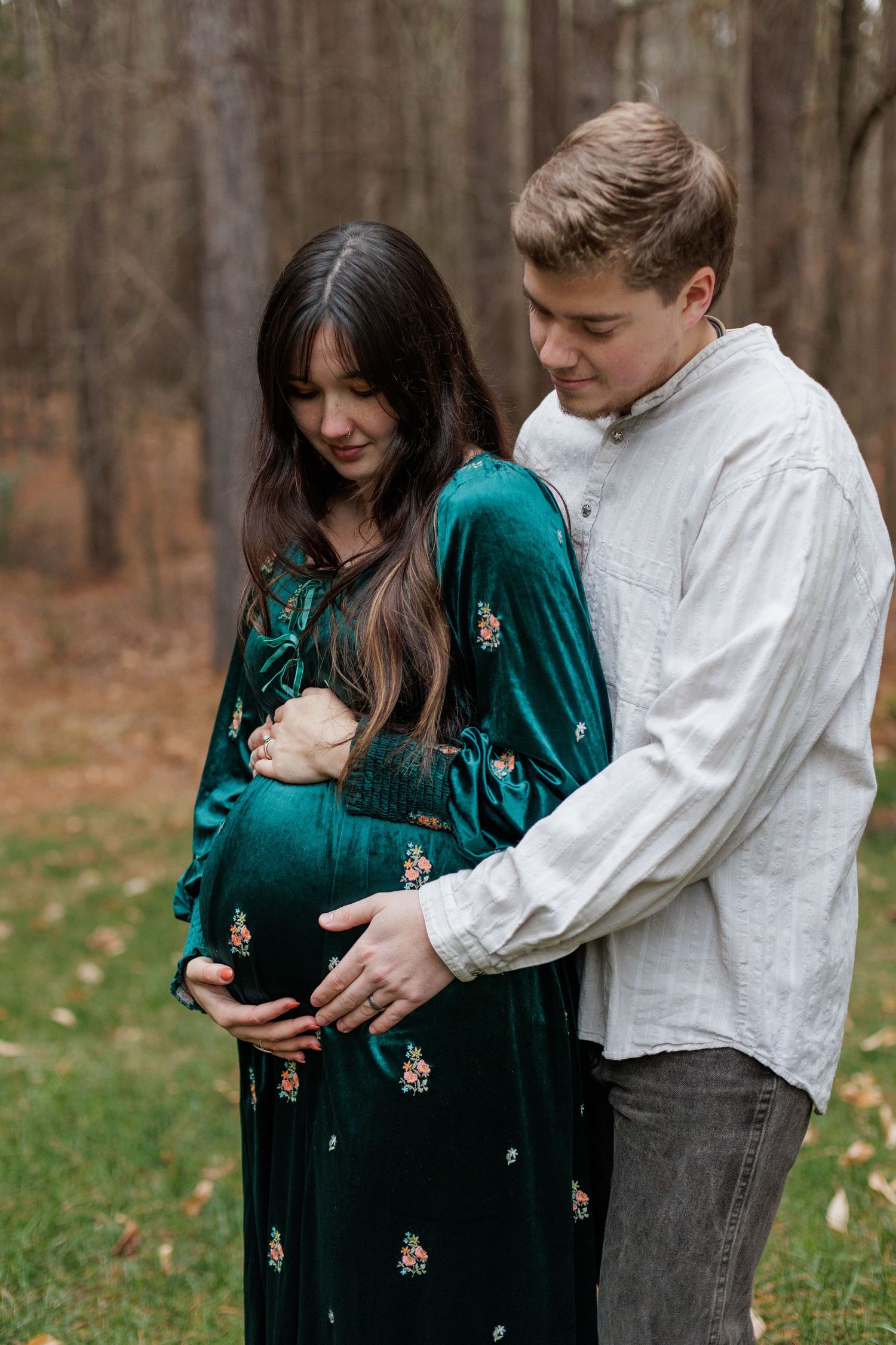 Maternity session in Williamsport Pennsylvania mom and dad looking down at pregnant belly