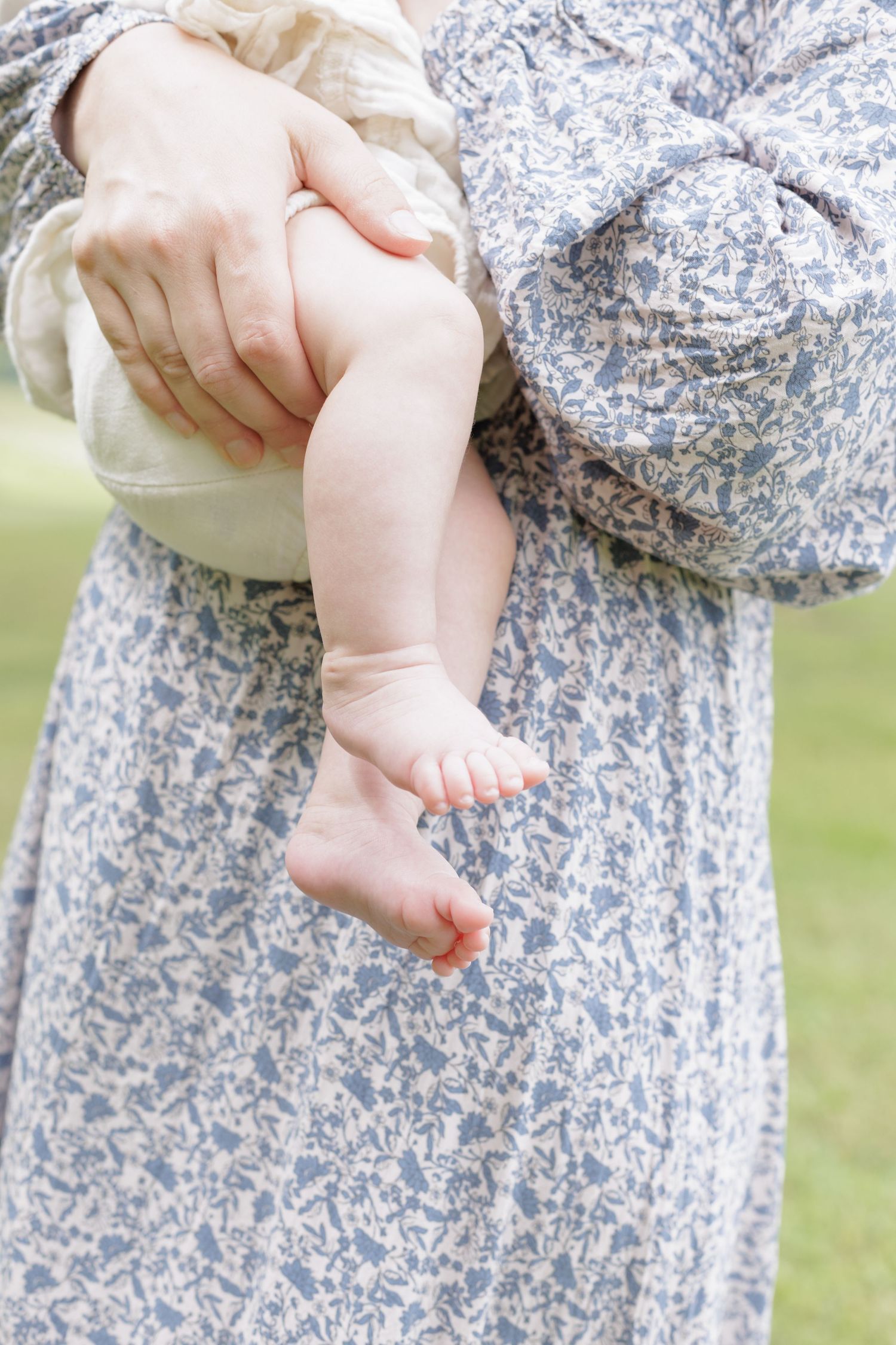 Mom holding newborn baby in an outdoor lifestlye session in Lock Haven, PA