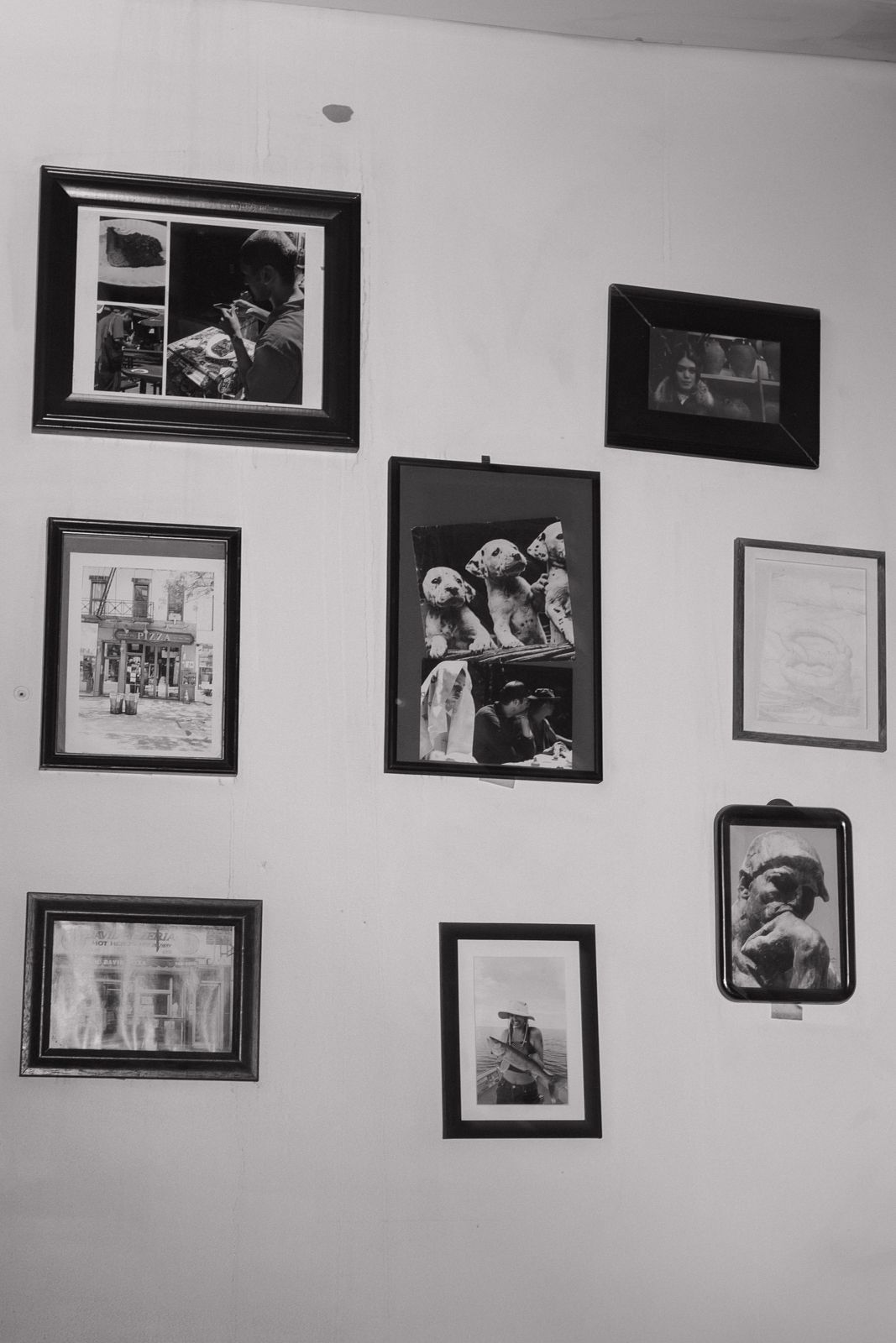 A black and white image of a gallery wall.