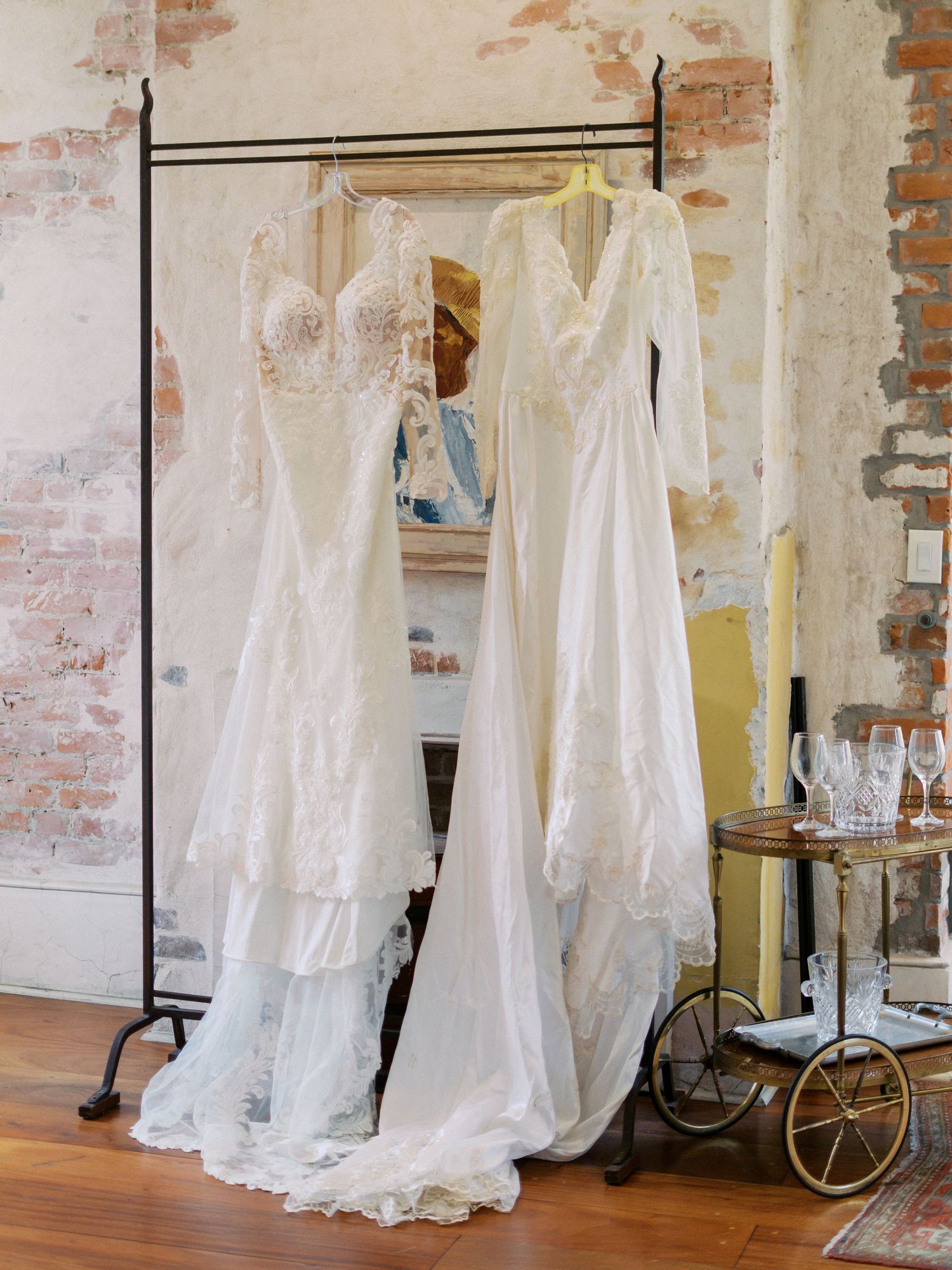 Brides dress hanging next to mother's dress, New Orleans wedding photography, Nicole Photo Co