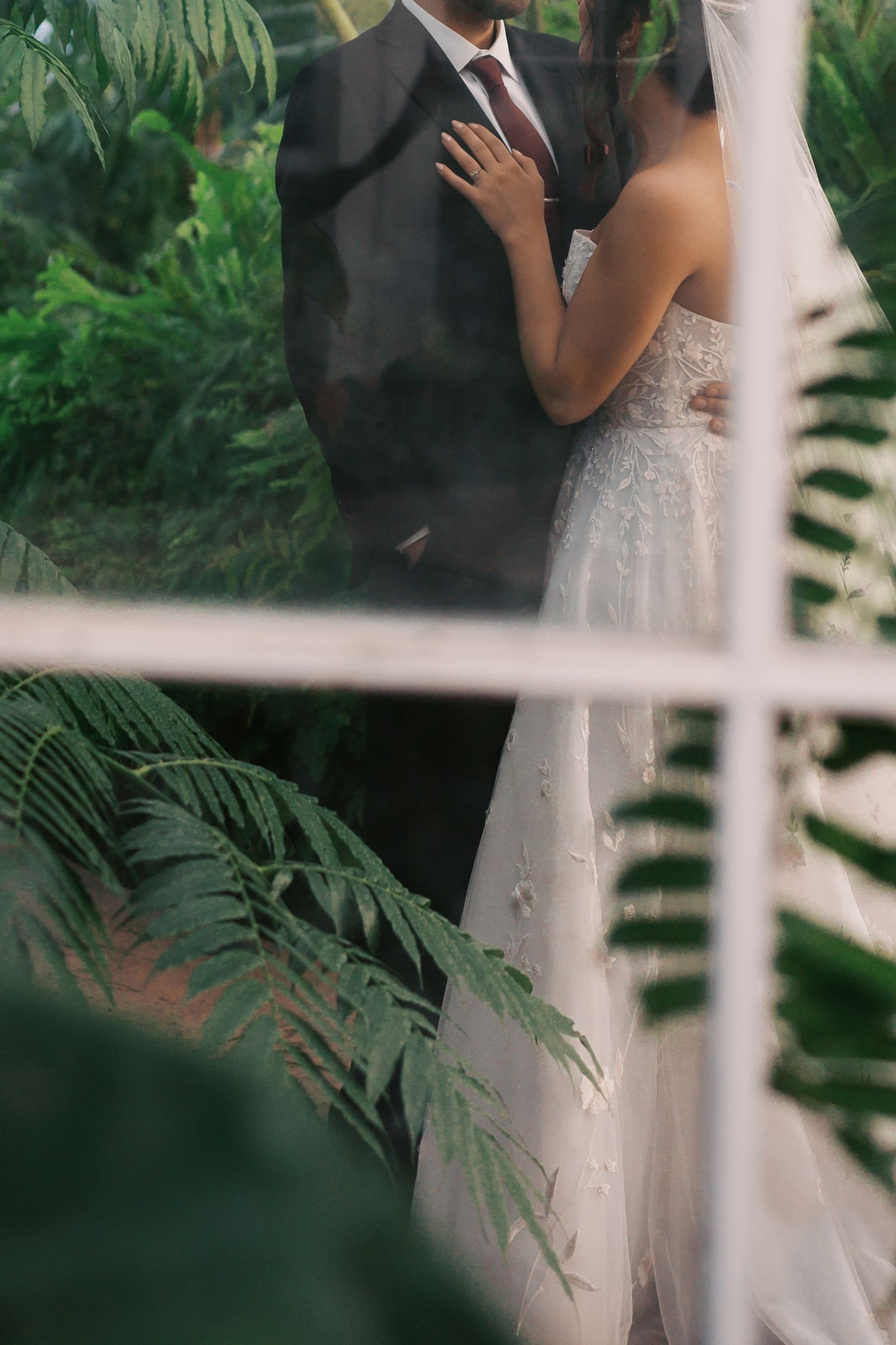 Couple behind glass, New Orleans wedding photography, Nicole Photo Co