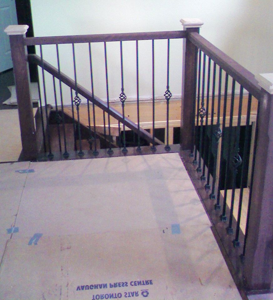 Dark wood and metal spindles.