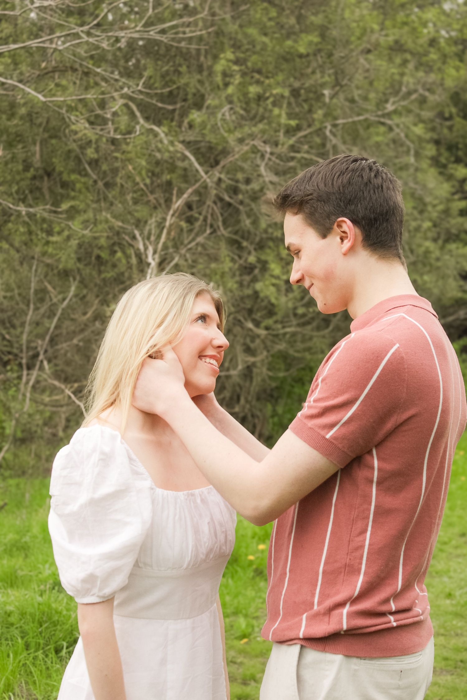 Couple laughing together during relaxed outdoor couples photography session.