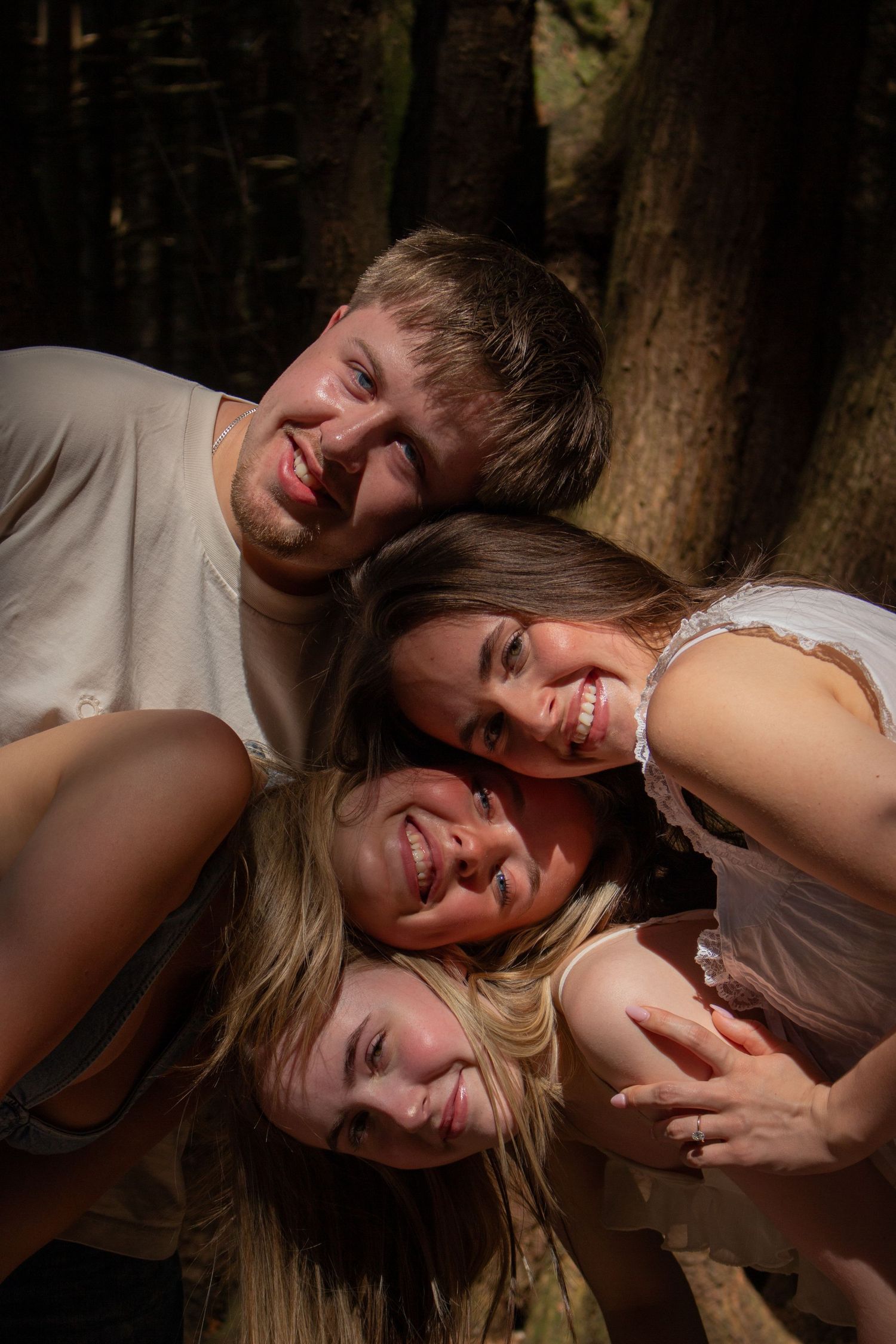 Siblings reminiscing on being young with a playful pose at our outdoor family  session.