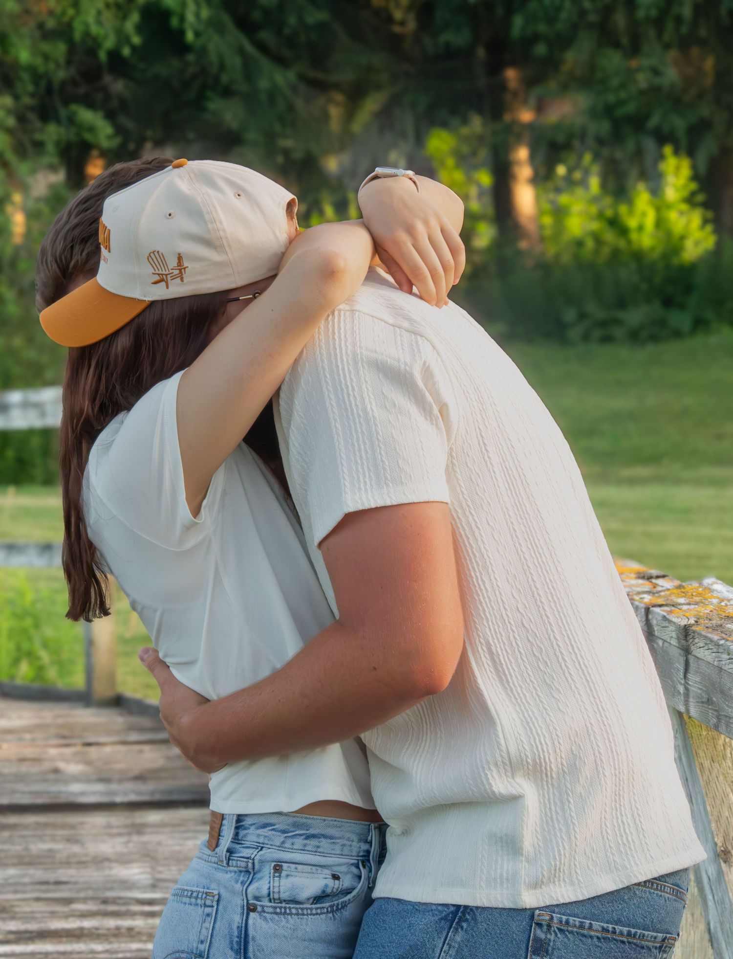 Couple hugging and laughing together during an outdoor couples session.