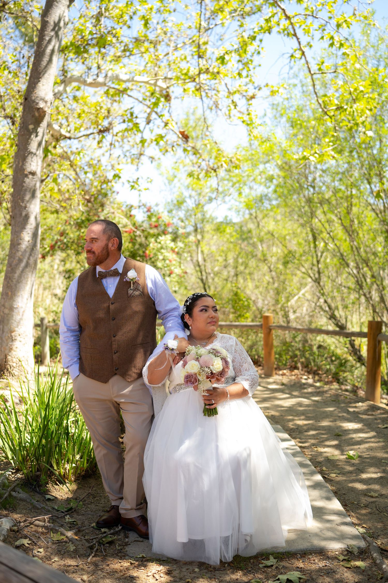 A series of outdoor wedding photos showing a couple sitting and posing together under trees with autumn foliage.