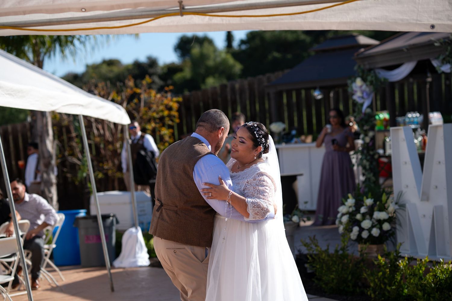 A series of romantic wedding photos showing tender moments between a couple during their outdoor ceremony.