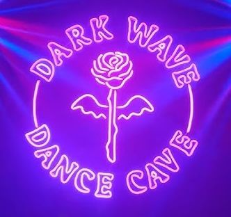 Neon purple dance cafe sign with rose design glowing in dark.
