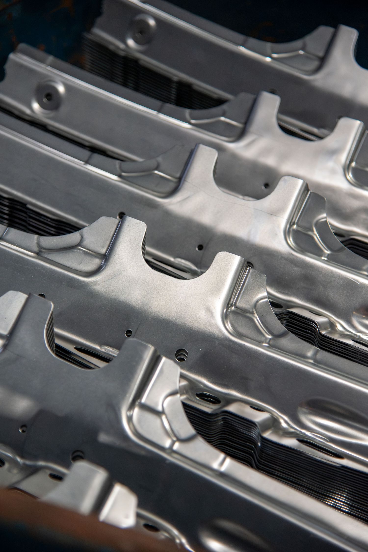 Close-up of industrial metal machinery parts with detailed grooves and patterns.