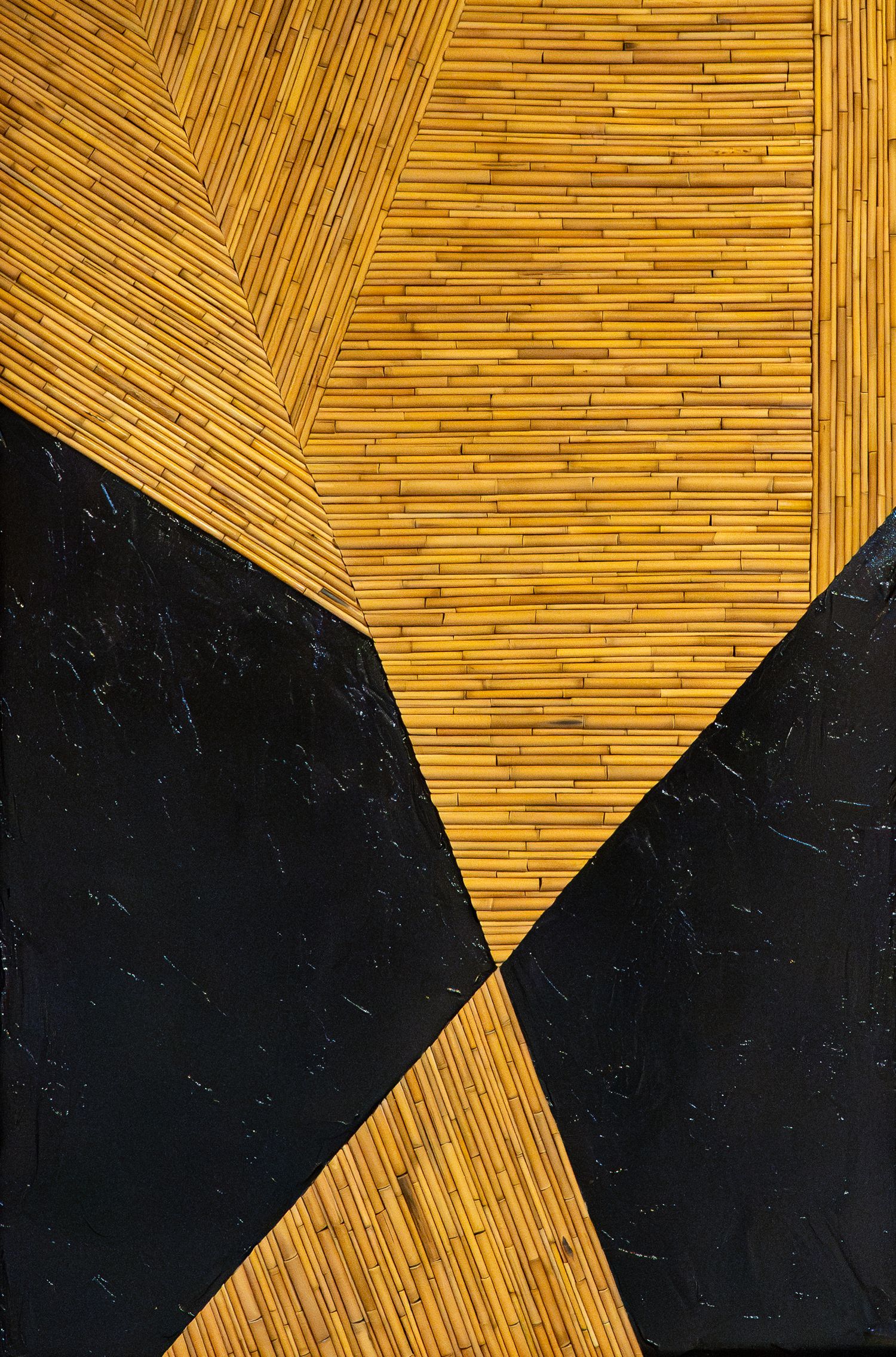 Abstract geometric art with golden bamboo sticks and black marble shapes forming bold angular patterns.