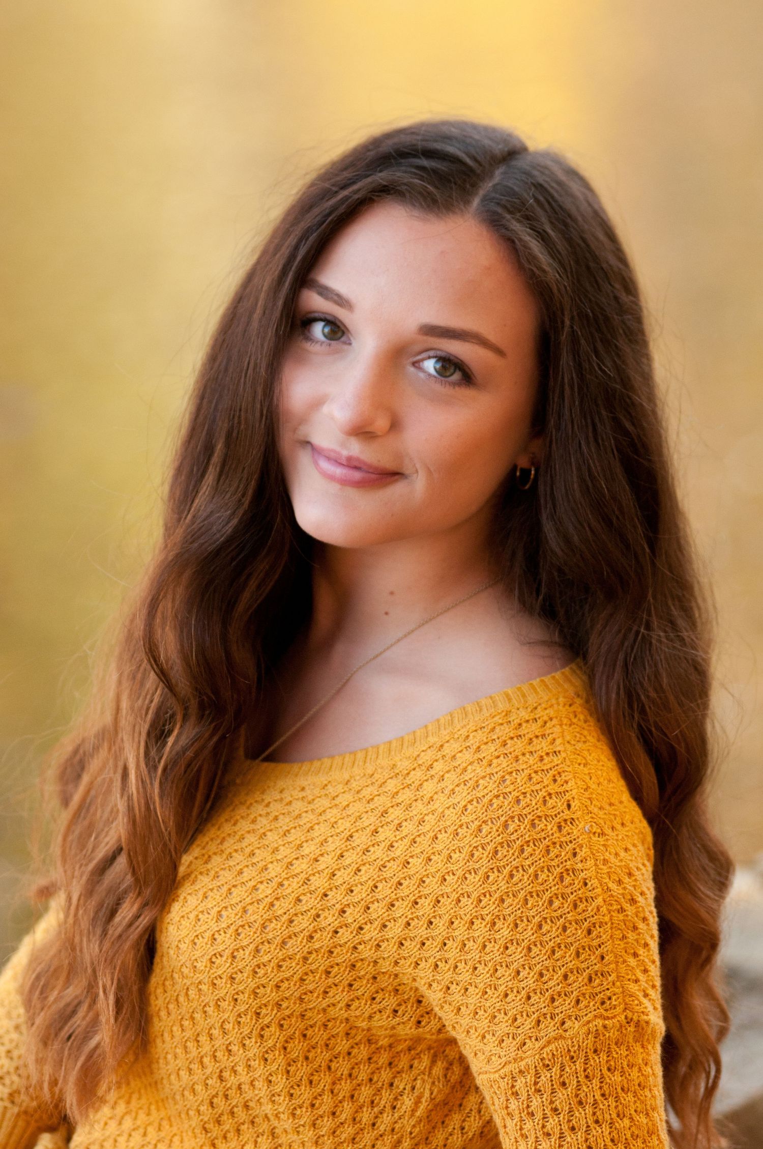 Portrait series featuring warm golden lighting and mustard yellow sweater.