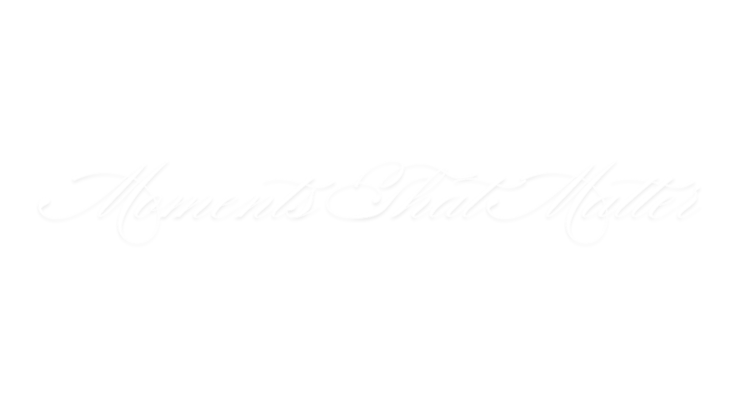 Faint white cursive calligraphy text reading Moments That Matter on a white background.