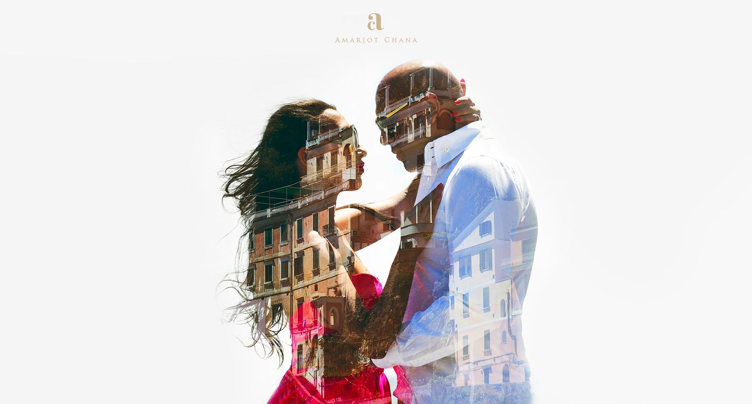 A stylish couple shares a tender moment in a creative double exposure cityscape portrait.