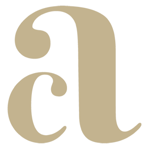 Amarjot Chana Photography logo – elegant gold cursive letter A on cream background, luxury Indian wedding photographer UK