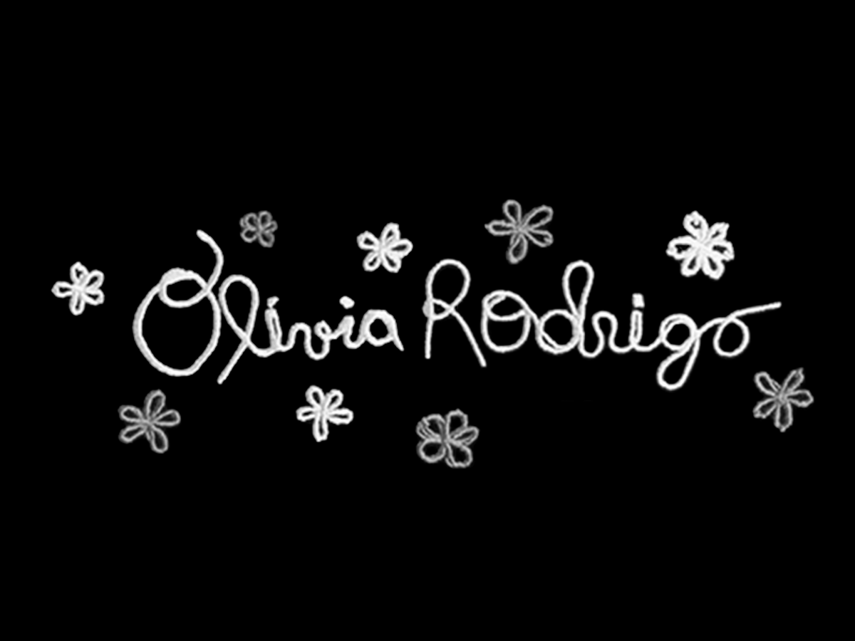 Olivia Rodrigo signature logo in white cursive script with floral decorations on black background.