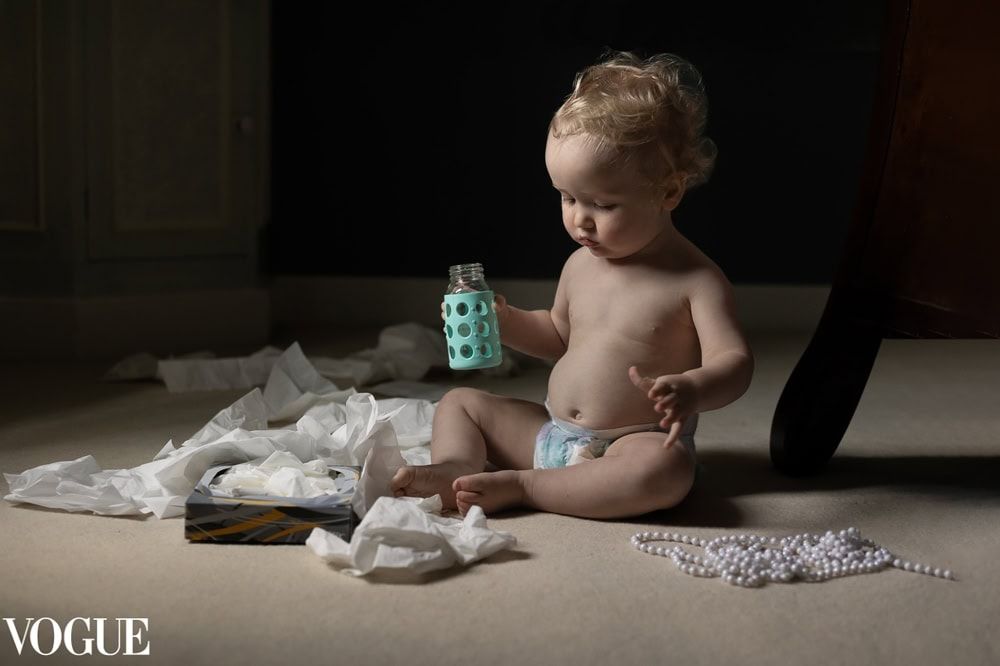 A young boy has unpacked a box of tissues onto the floor at home in Maidenhead.