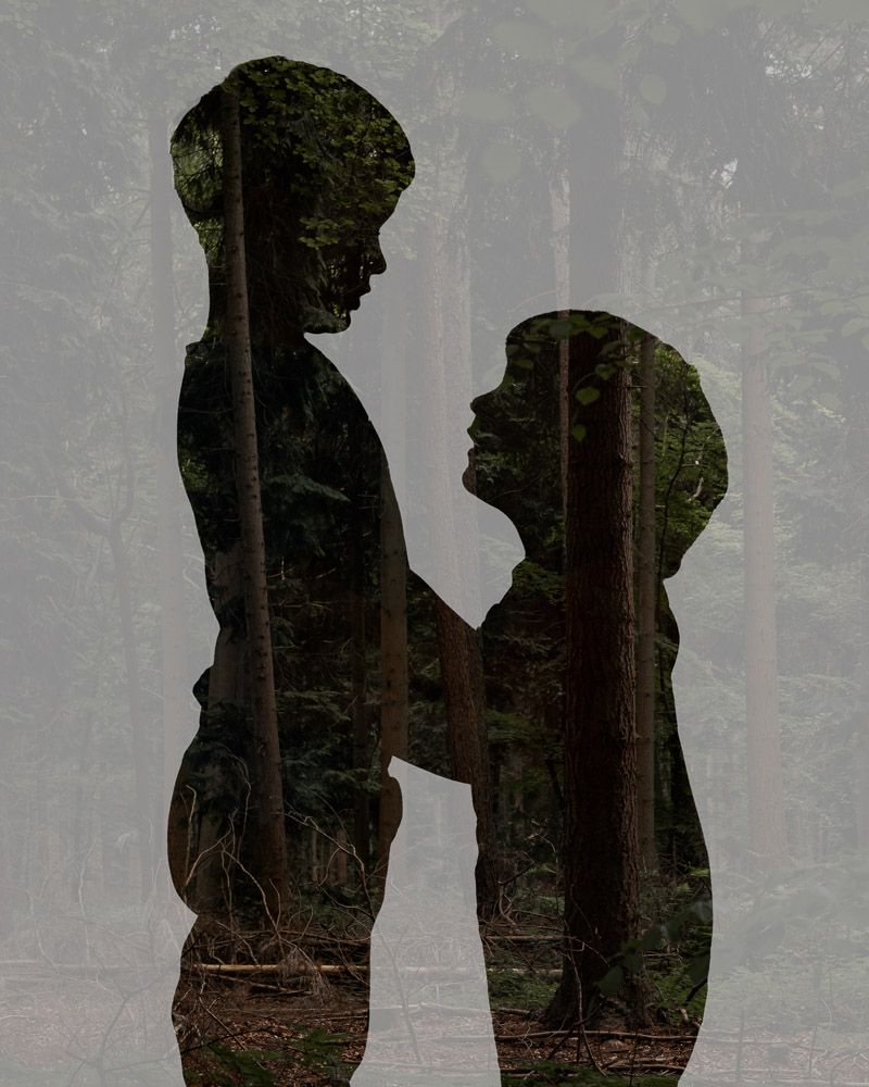 A multiple exposure of two boys and a forest, to represent the element of earth.