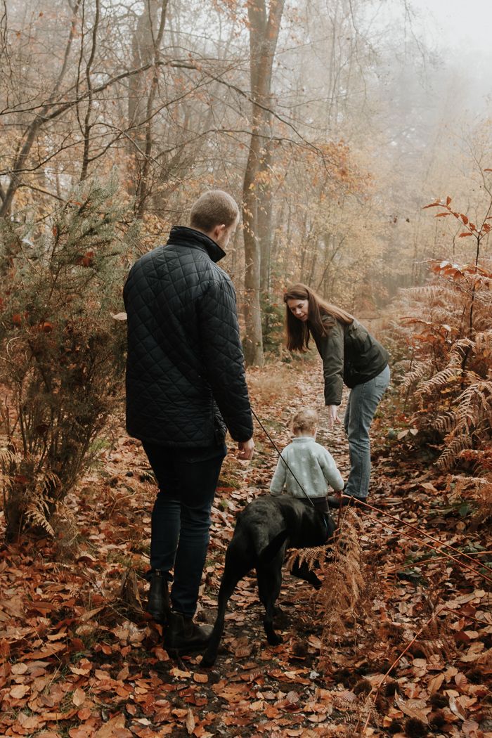 A family make their way down a woodland path in Marlow Common.