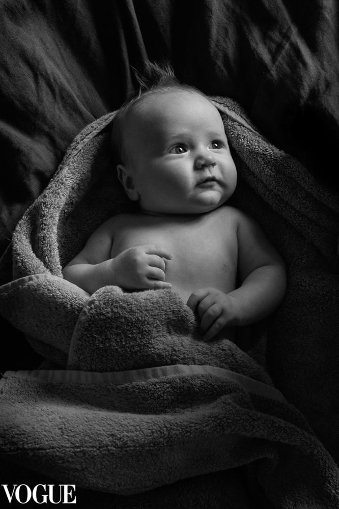 A six-month-old baby wrapped in a towel after his bath at home near Maidenhead.
