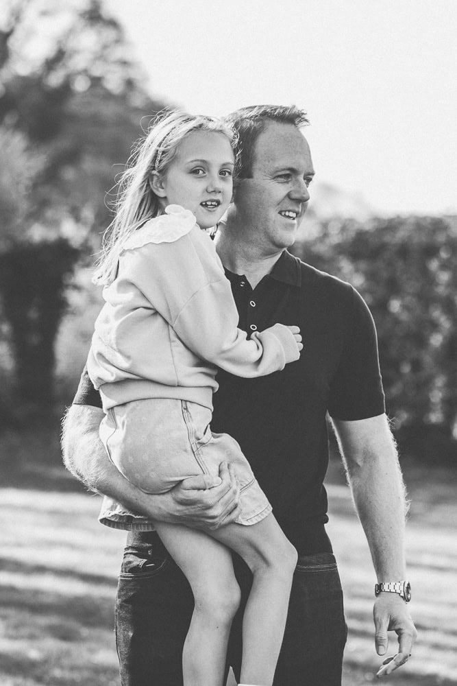 A father carries his daughter in Hambleden valley.
