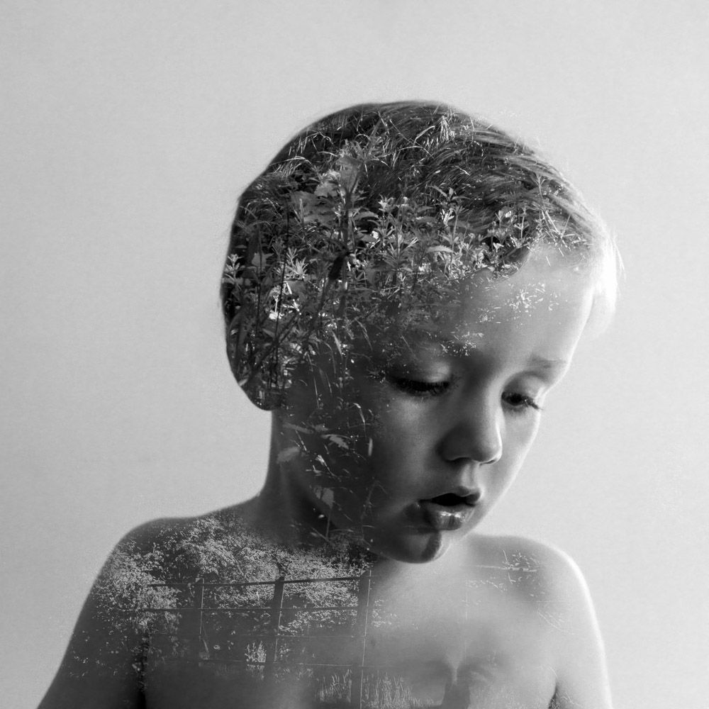 A double exposure of a boy and his forest school