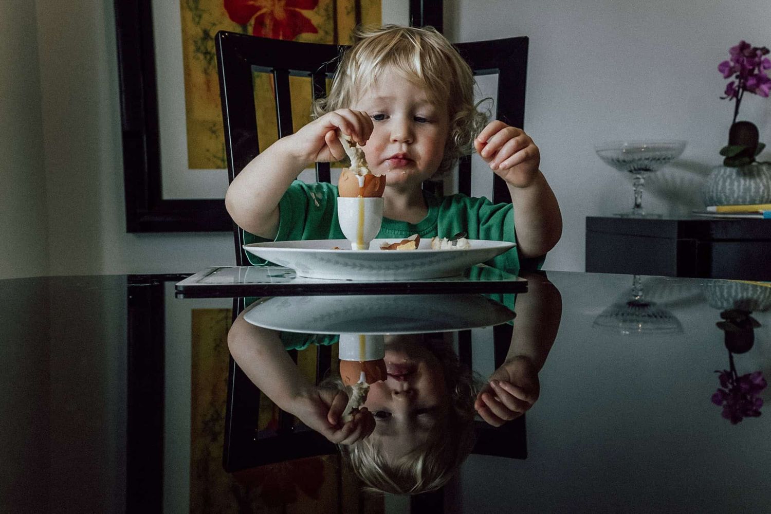 A boy dips his toast 