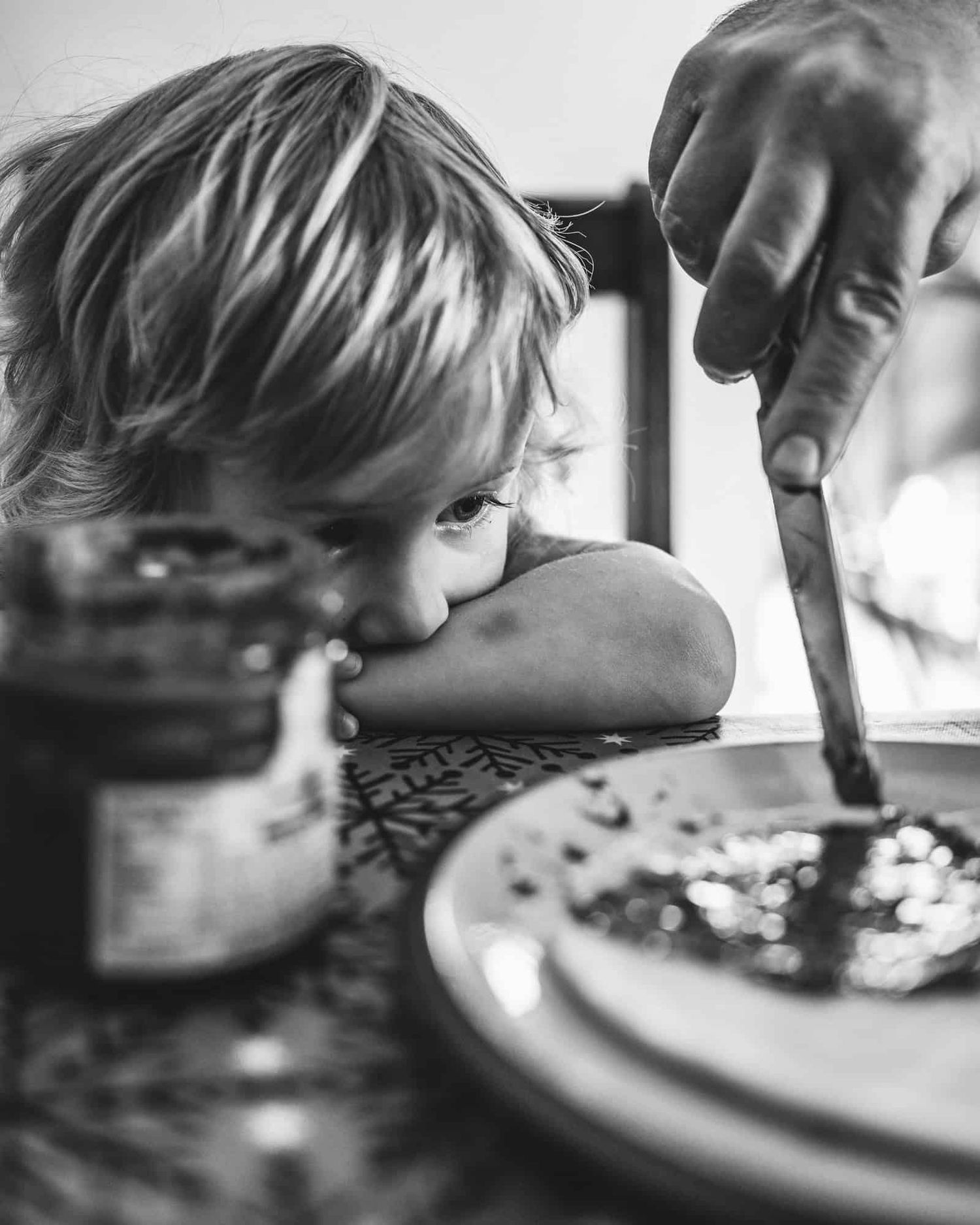 A boy eating pancakes for breakfast.