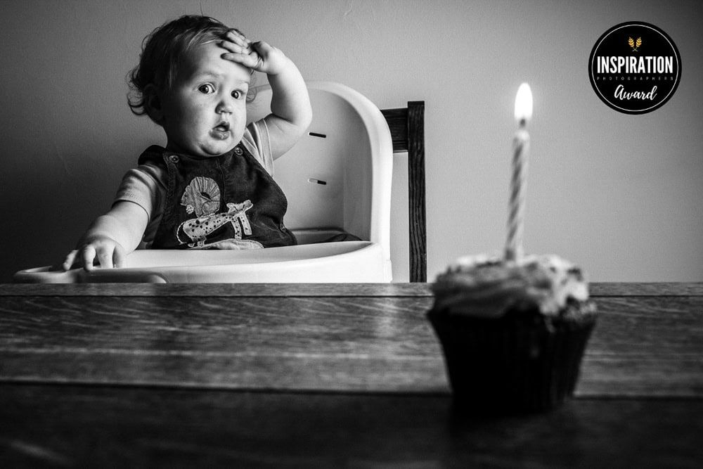 An inspiration awarded photograph of a young boy striking a dramatic pose on his first birthday.