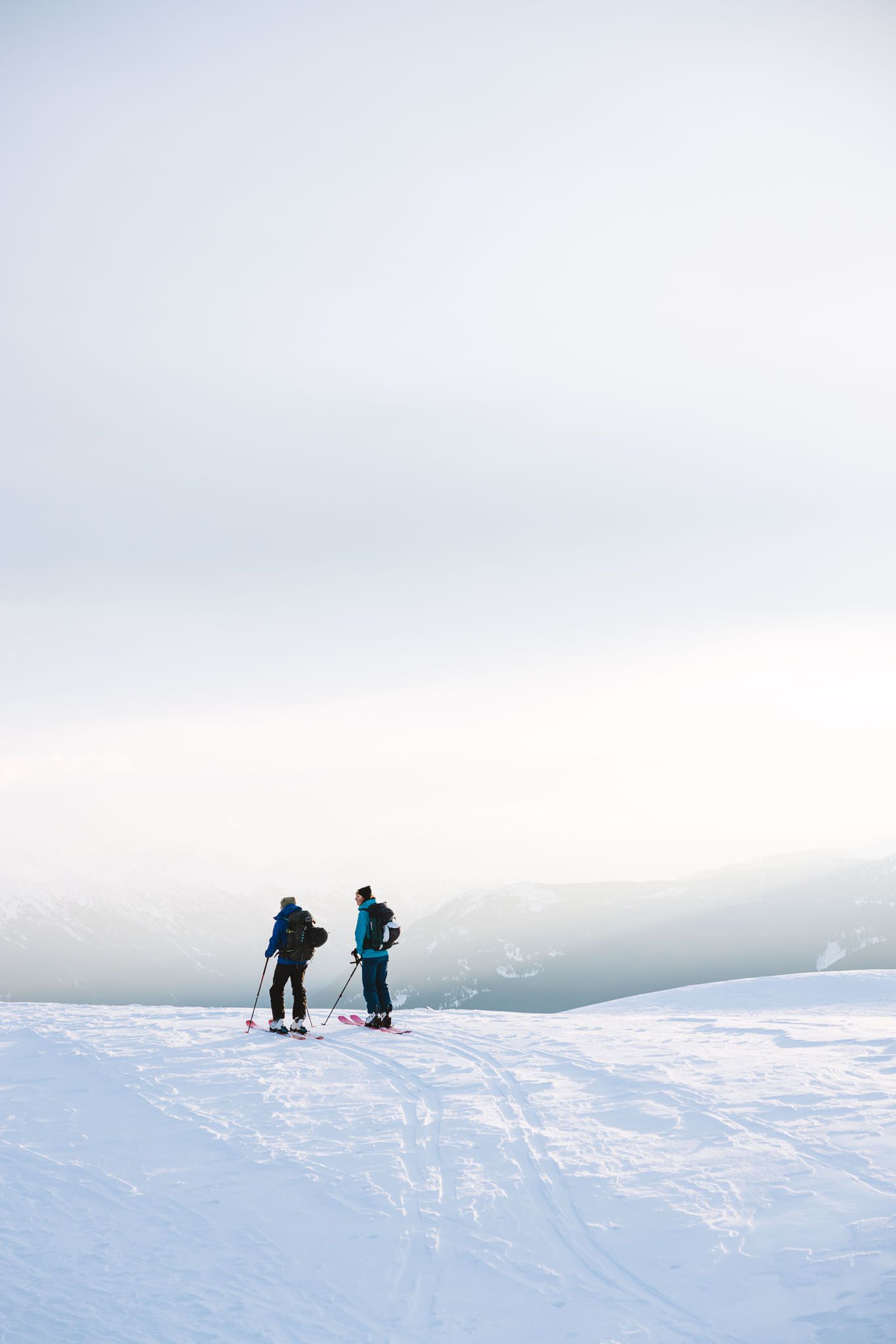 A couple backcountry skiing near Brew Hut.