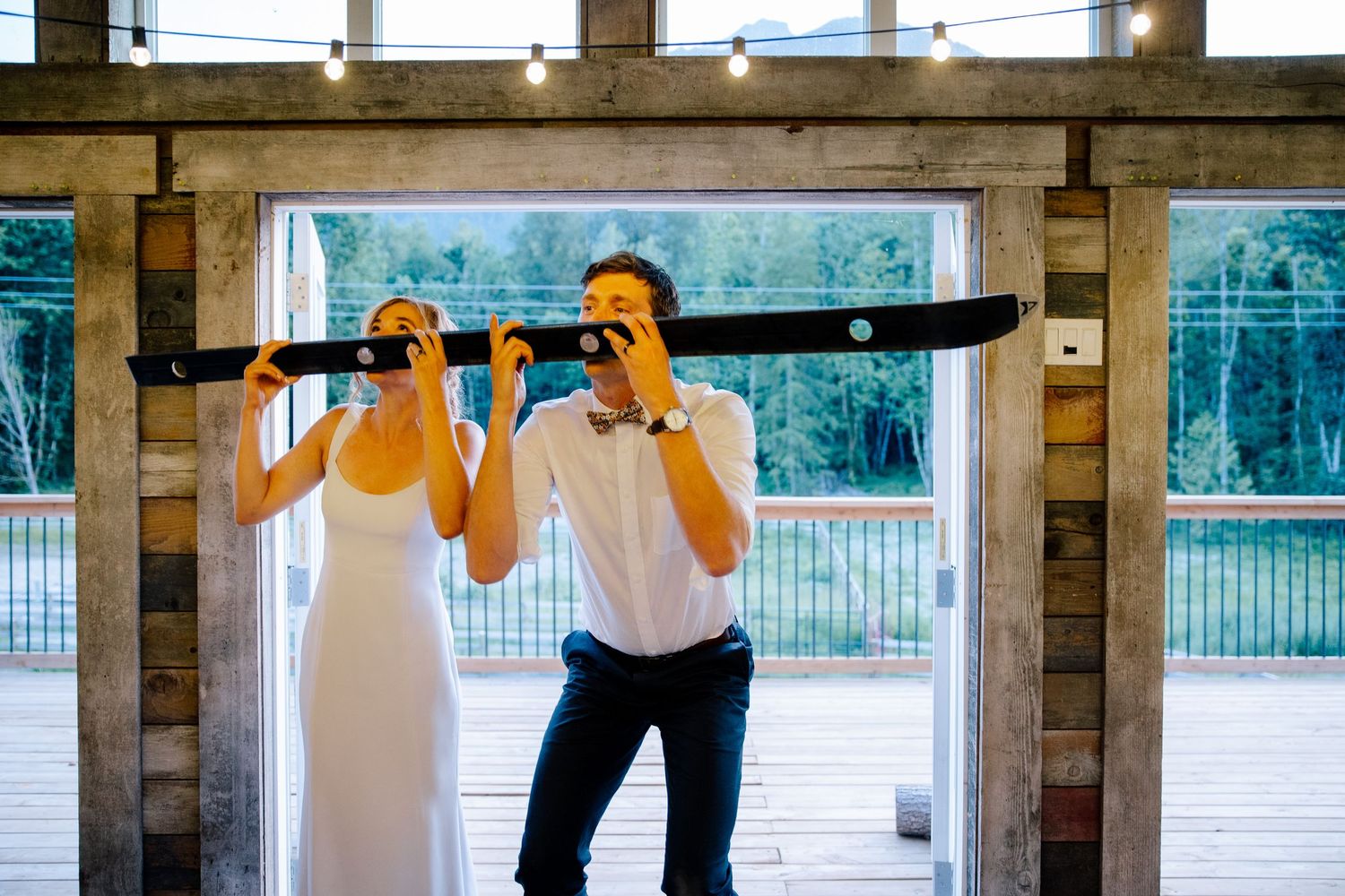 Wedding couple doing shot ski.