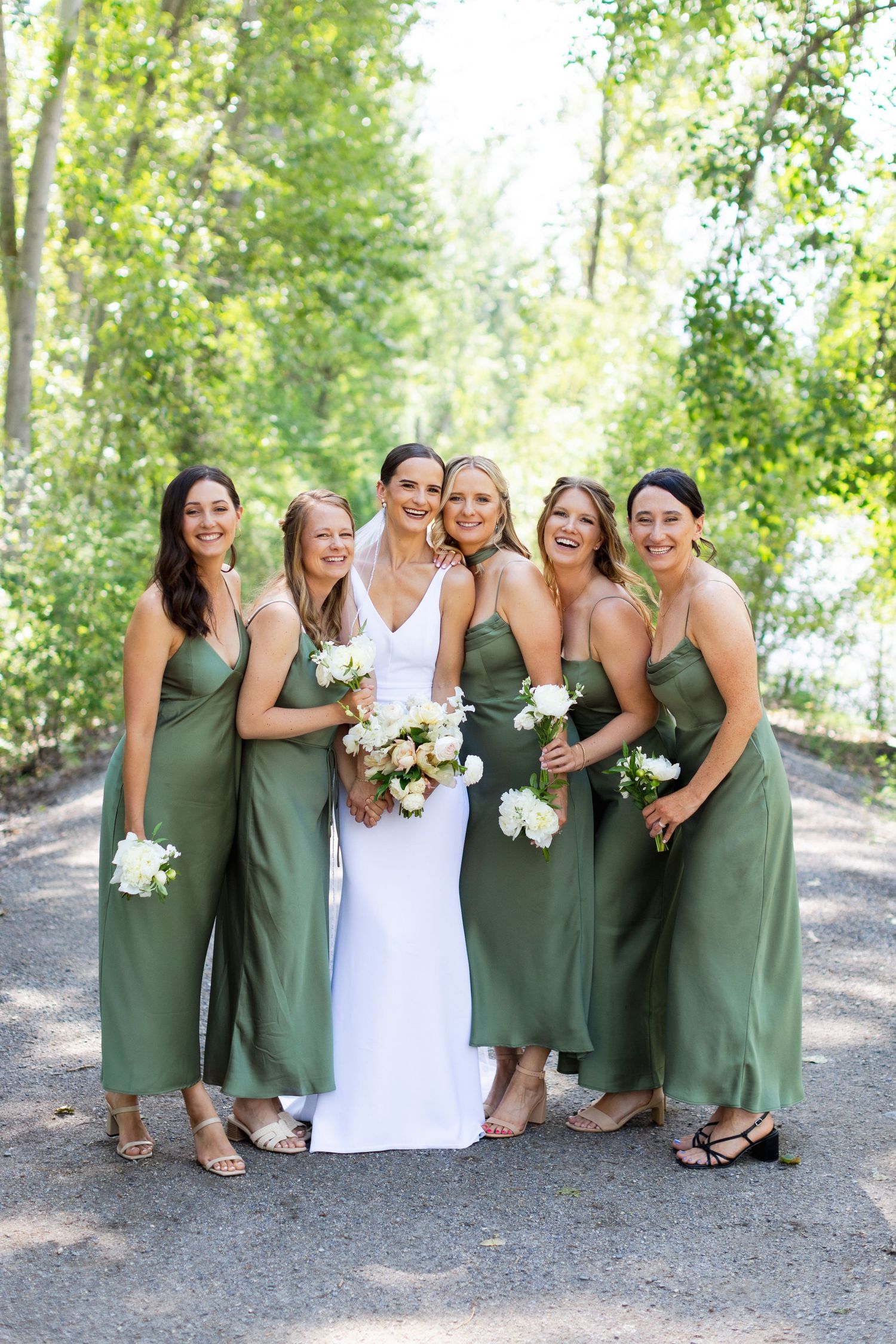 Bridal party portrait in forest setting.