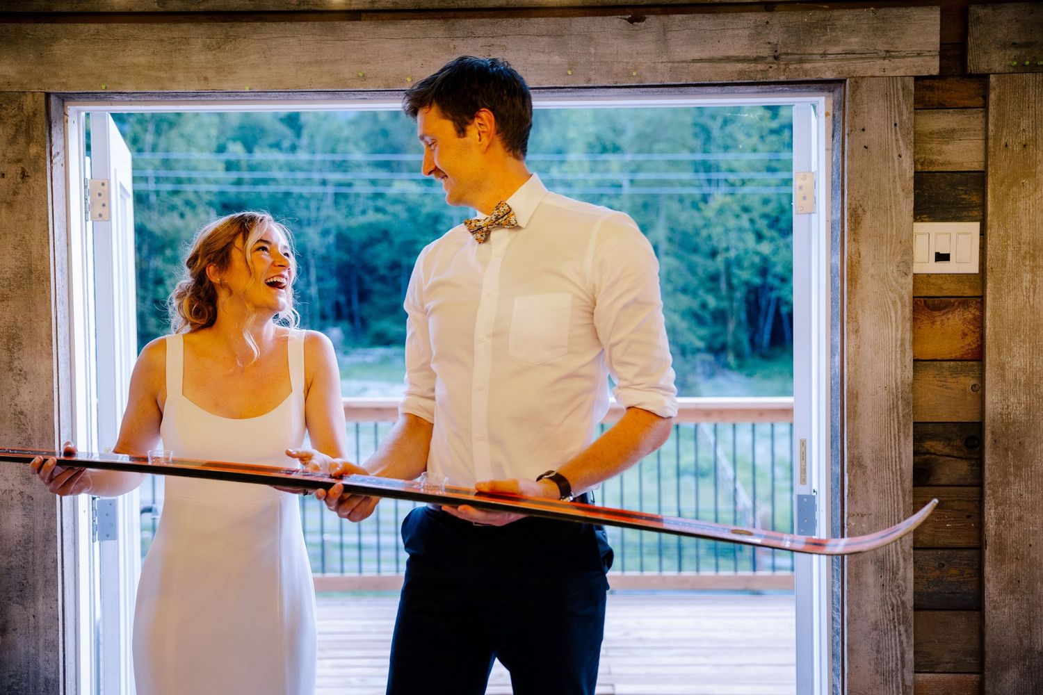Wedding couple doing shot ski.