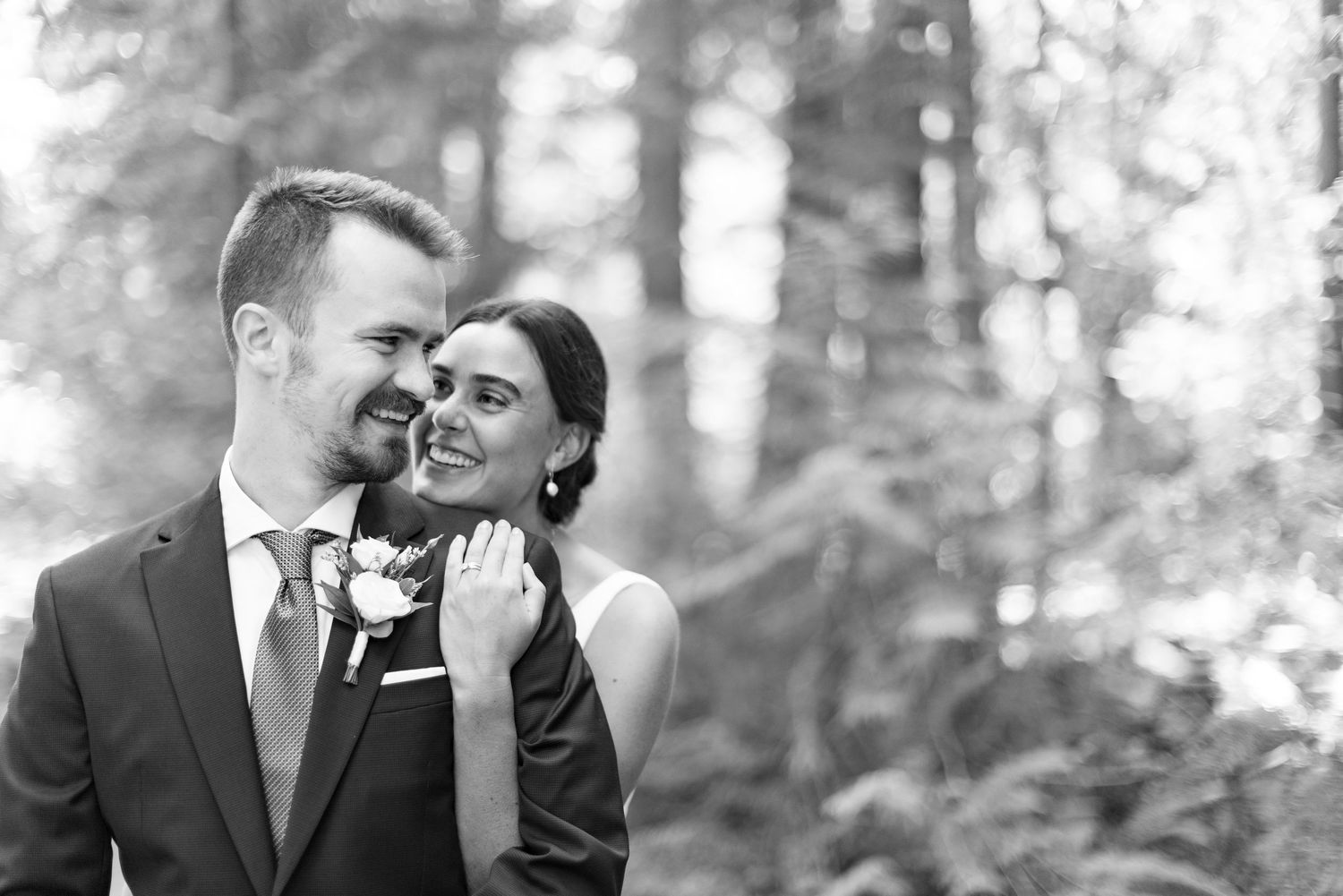 Groom portrait in light beige suit on wedding day.