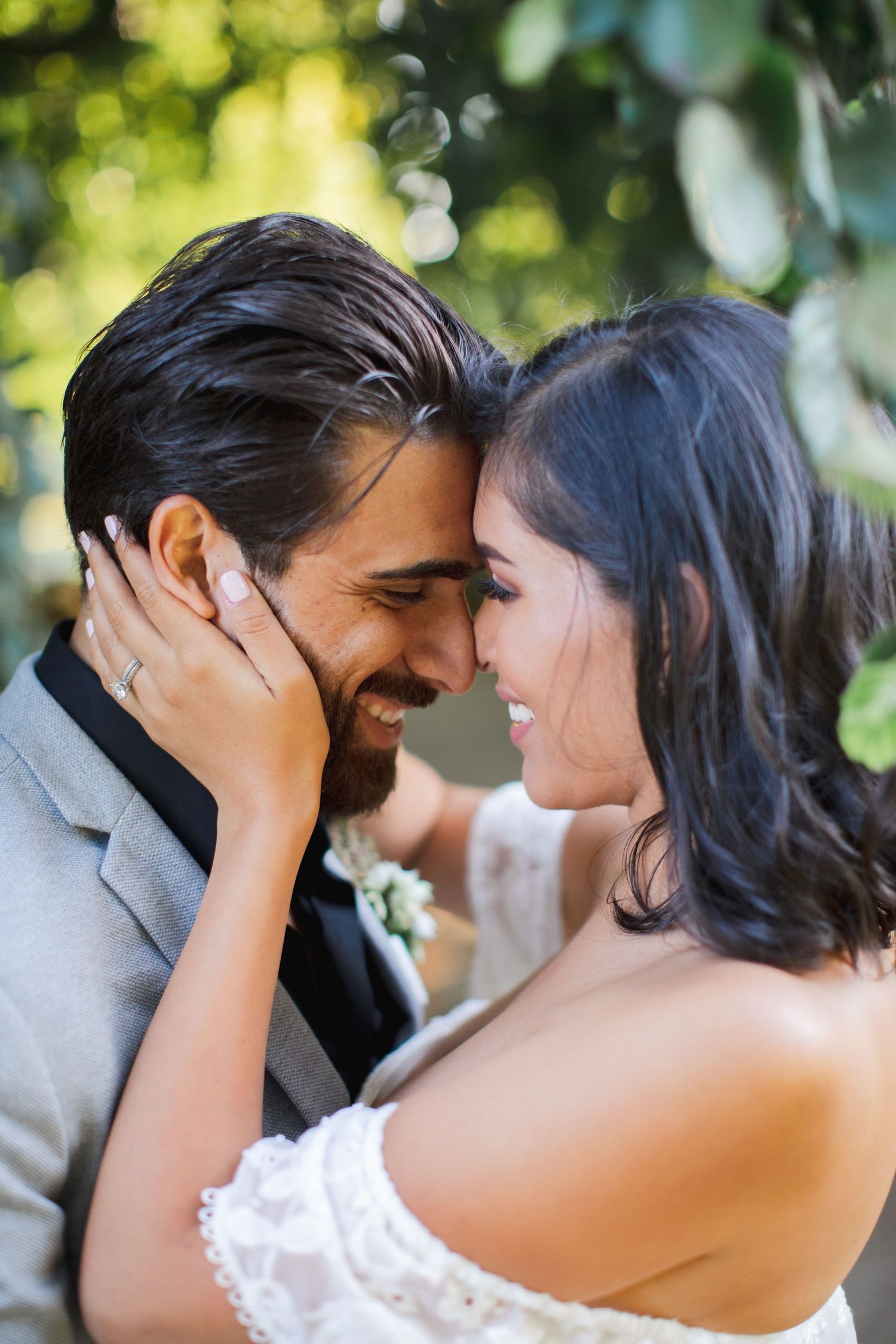Emotional close-up of bride adjusting earrings before ceremony.
