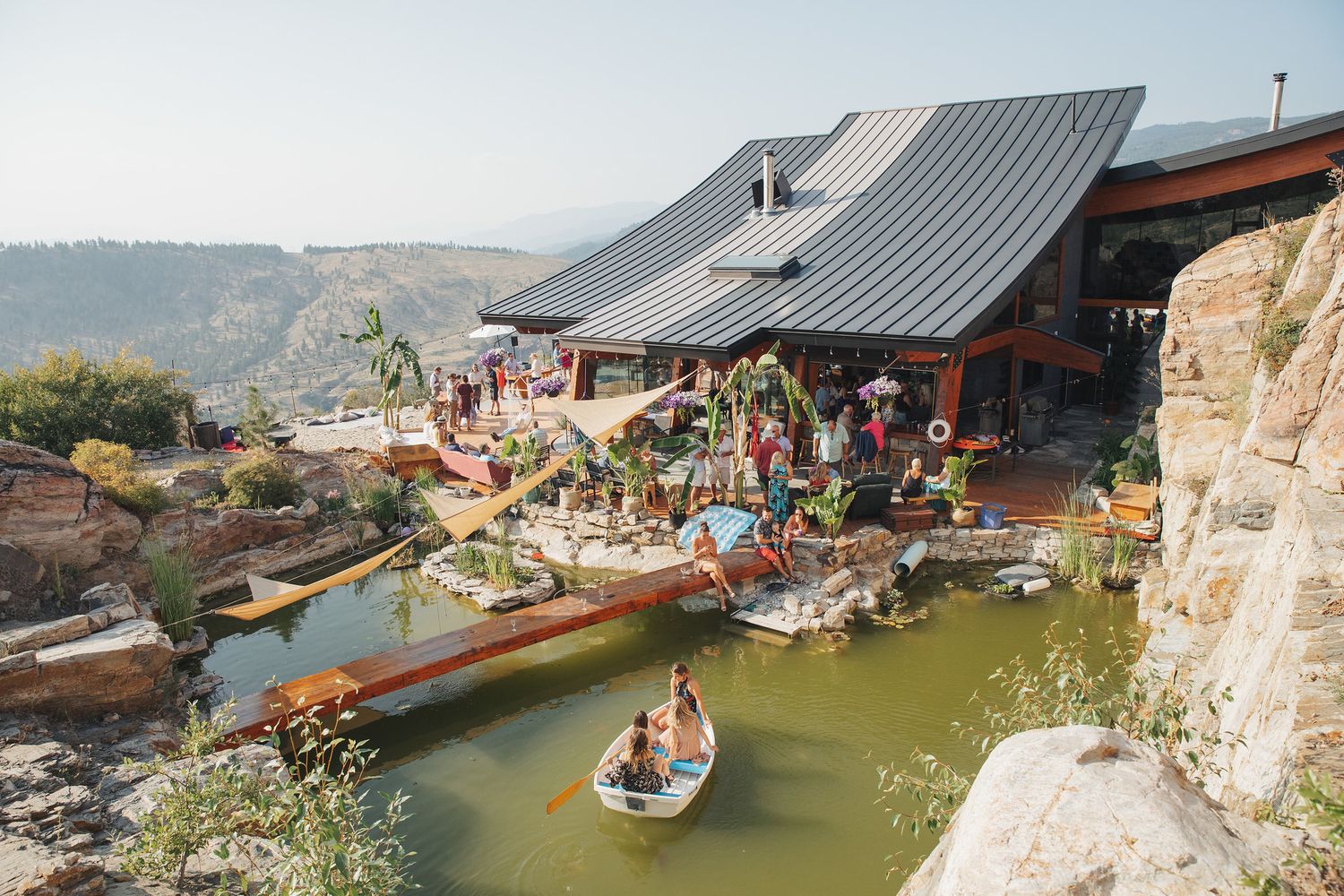 Modern mountain venue hosting outdoor wedding reception.