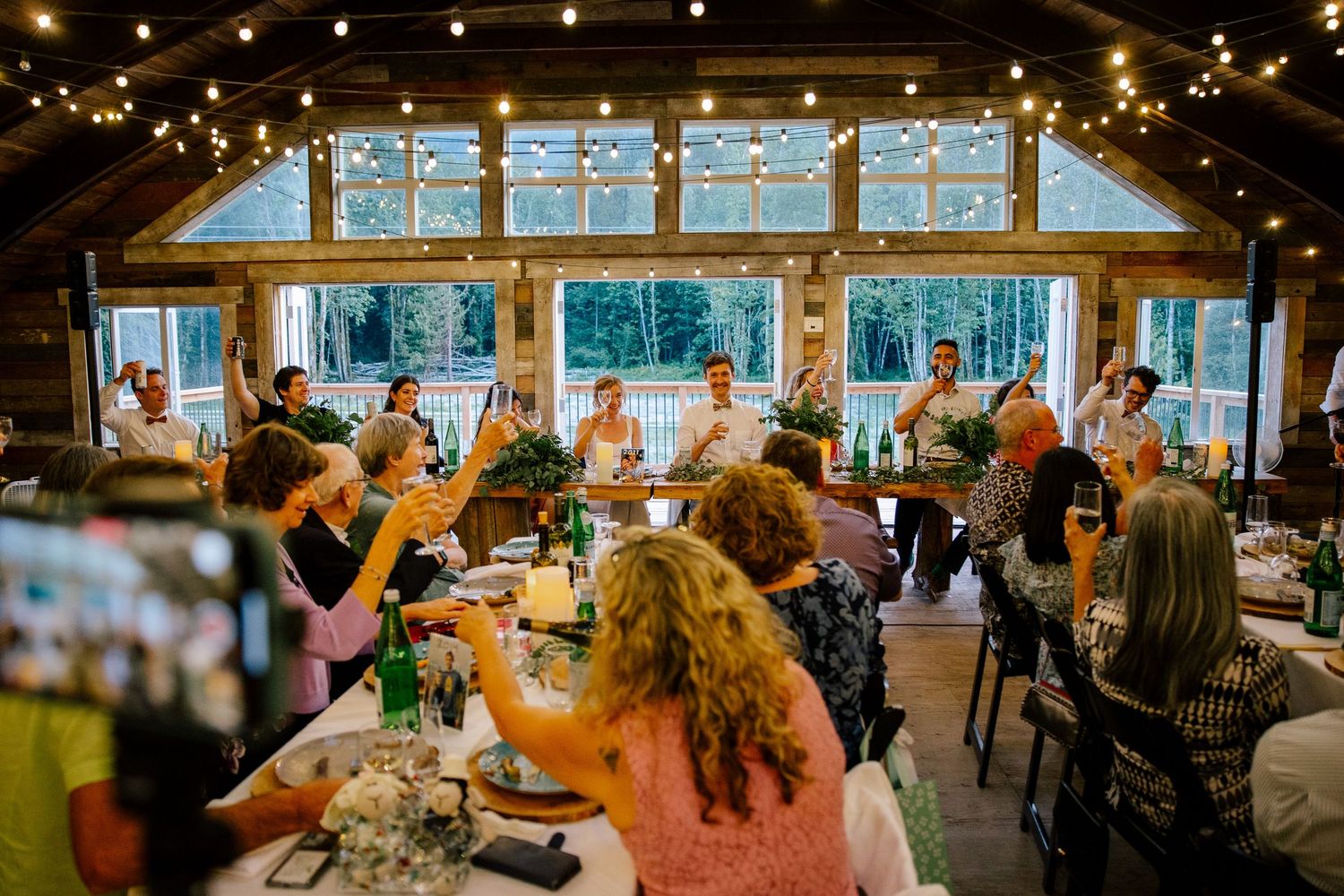 Toast during wedding reception inside the barn at Glacier Valley Farm in Squamish, BC.